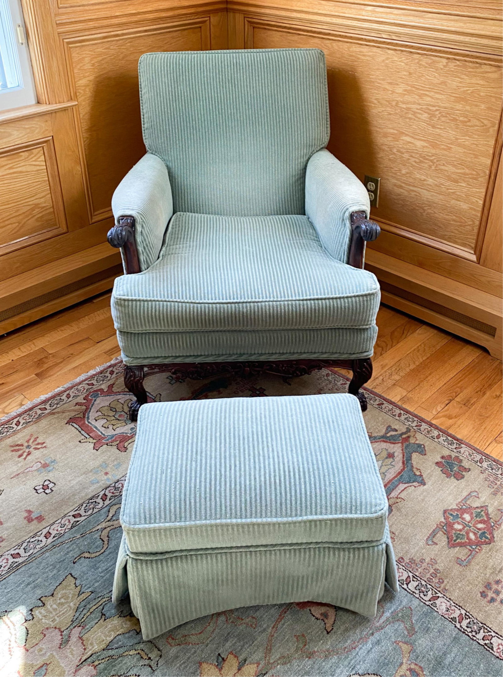 CARVED FRAME LOUNGE CHAIR & OTTOMAN: In striped sage green upholstery. Chair with carved armrests and legs. No labels. Dimensions: (Chair) H 35" x W 31" x D 40" x SH 17" Condition: Upholstery with minor wear, few small spots, and light f