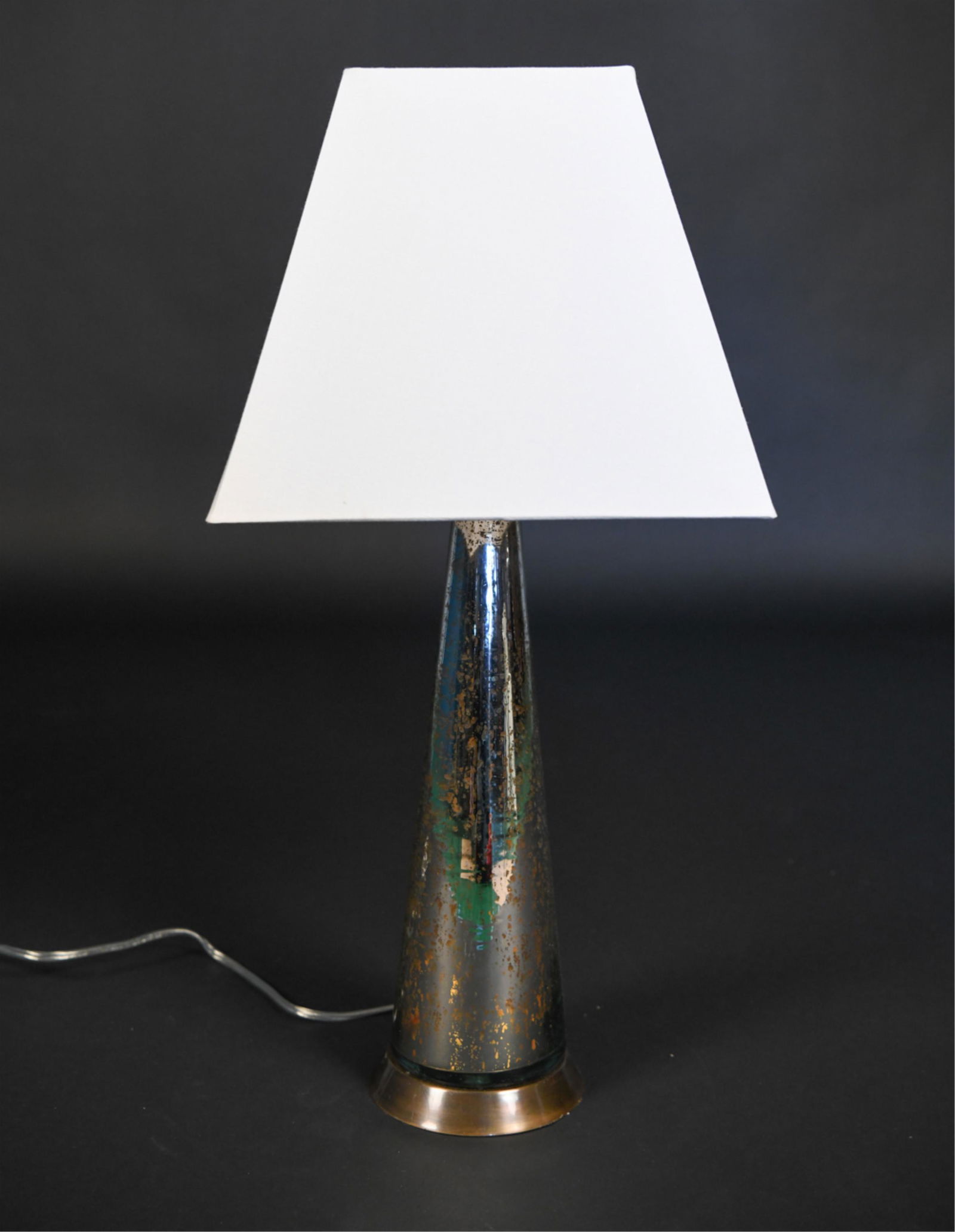 CONTEMPORARY MODERN GLASS LAMP: Arteriors home, Made in India. Glass lamp base with gold leafing design. Brushed metal base. Dimensions: H 28" x D 5.5" Shade: H 11.5" x D 13" Condition: Missing harp.