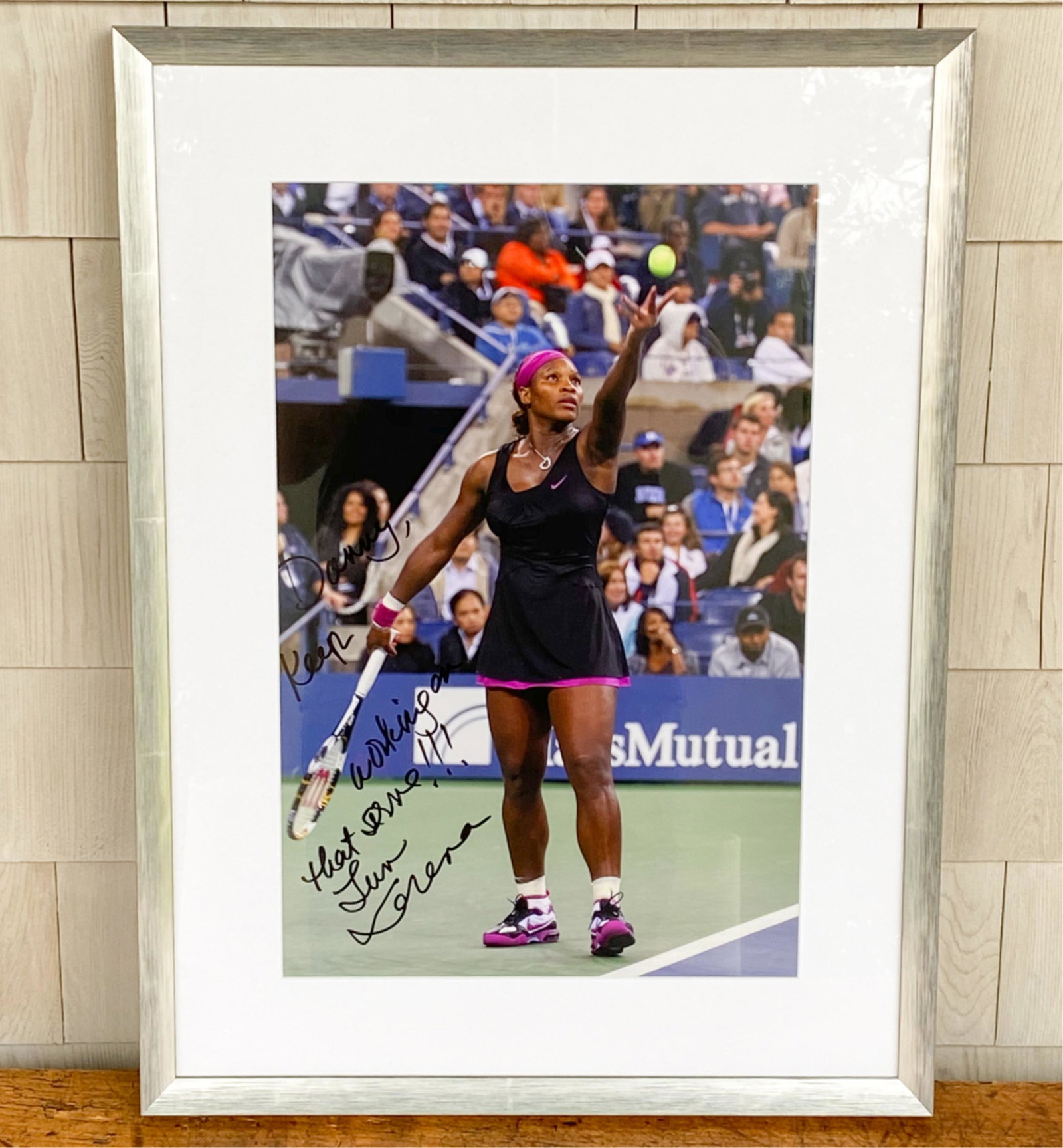 SERENA WILLIAMS SIGNED PHOTOGRAPH: Signed and dedicated "Keep working on that serve!!!" Dimensions: (Frame) H 23.5" x W 17.5" Condition: Few minor scratches to frame.