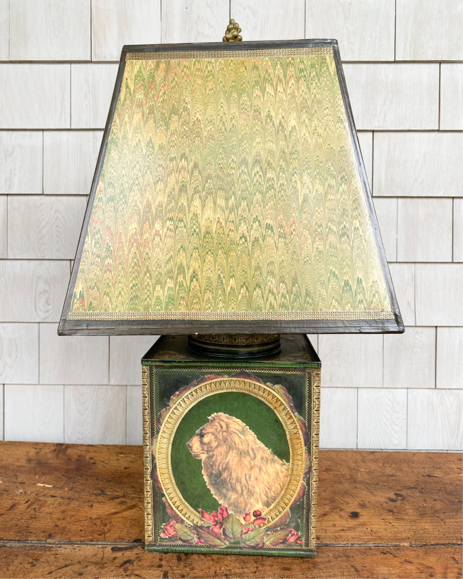 TIN JUNGLE ANIMAL LAMP: With print appliques of jungle animals including lion, elephant. Dimensions: (Incl. shade) H 27" x W 14" x D 14" Condition: Some small surface losses and slight peeling at edges. Wear to shade. Not te