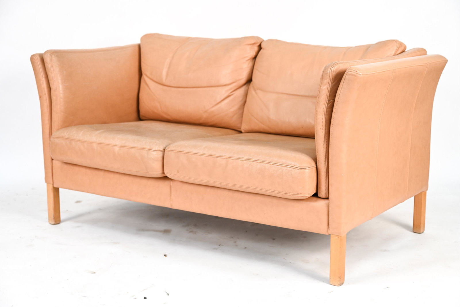 DANISH MID-CENTURY LEATHER 2-SEATER SOFA: Two-seater loveseat sofa. Dimensions: H 28" x W 59" x D 30" x SH 16" Condition: Some creasing, wear to leather, few spots of soiling. Light wear to legs. N014