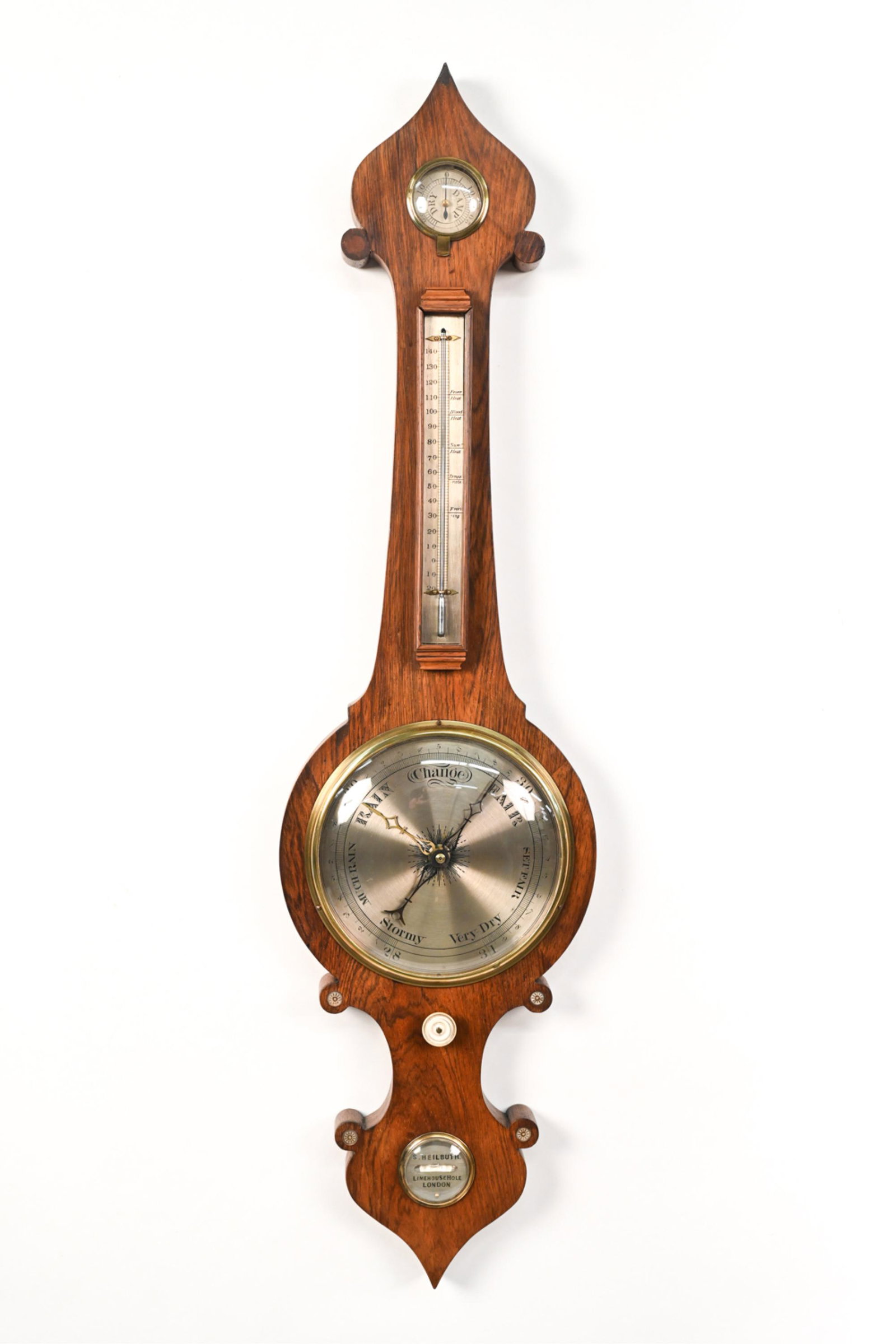 S. HEILBUTH LIMEHOUSE HOLE LONDON BAROMETER: Marked to bottom: S. Heilbuth, Limehouse hole, London. With bone knob. Dimensions: H 39.25" x W 10" x D 2" Condition: Few small stress cracks to wood. Not tested for accuracy. Light wear to knob. Slig