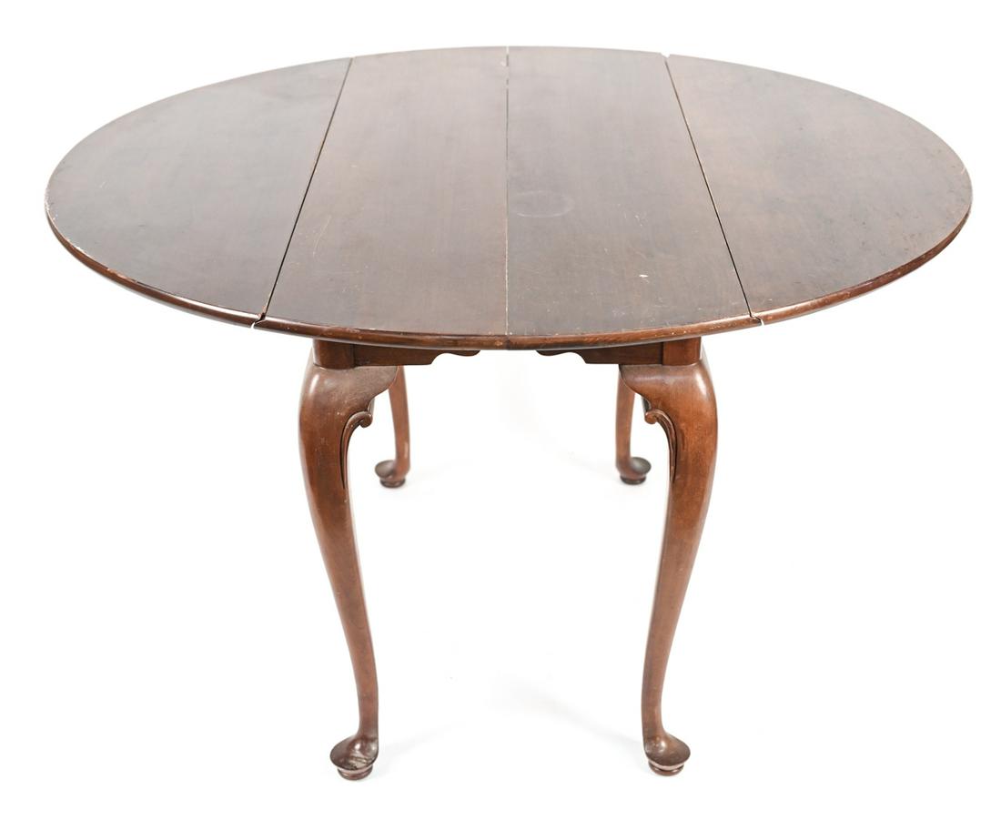 DROP LEAF TABLE: Cabriole legs. Dimensions: (Leaves down) H 29.25" x W 41.75" x D 21.25", (Each leaf) D 13.5" Condition: No extra leaves included. Water stains to top. Scratches, scuffs, and marks to surface. Few smal