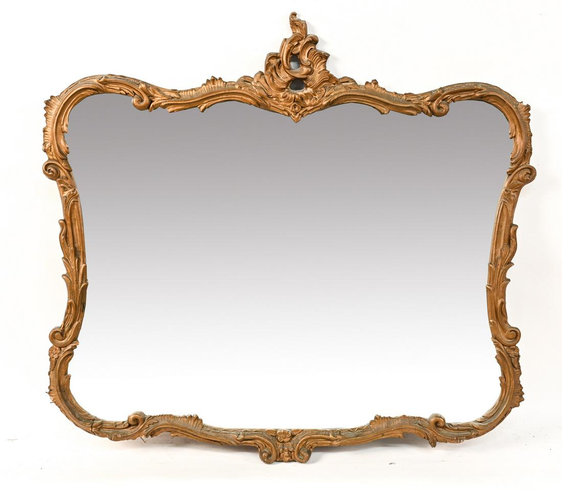 ROCOCO STYLE WALL MIRROR: Faux gilt frame. Dimensions: H 33.75" x W 35.5" Condition: Losses, cracks, wear to frame. Some de-silvering to mirror.