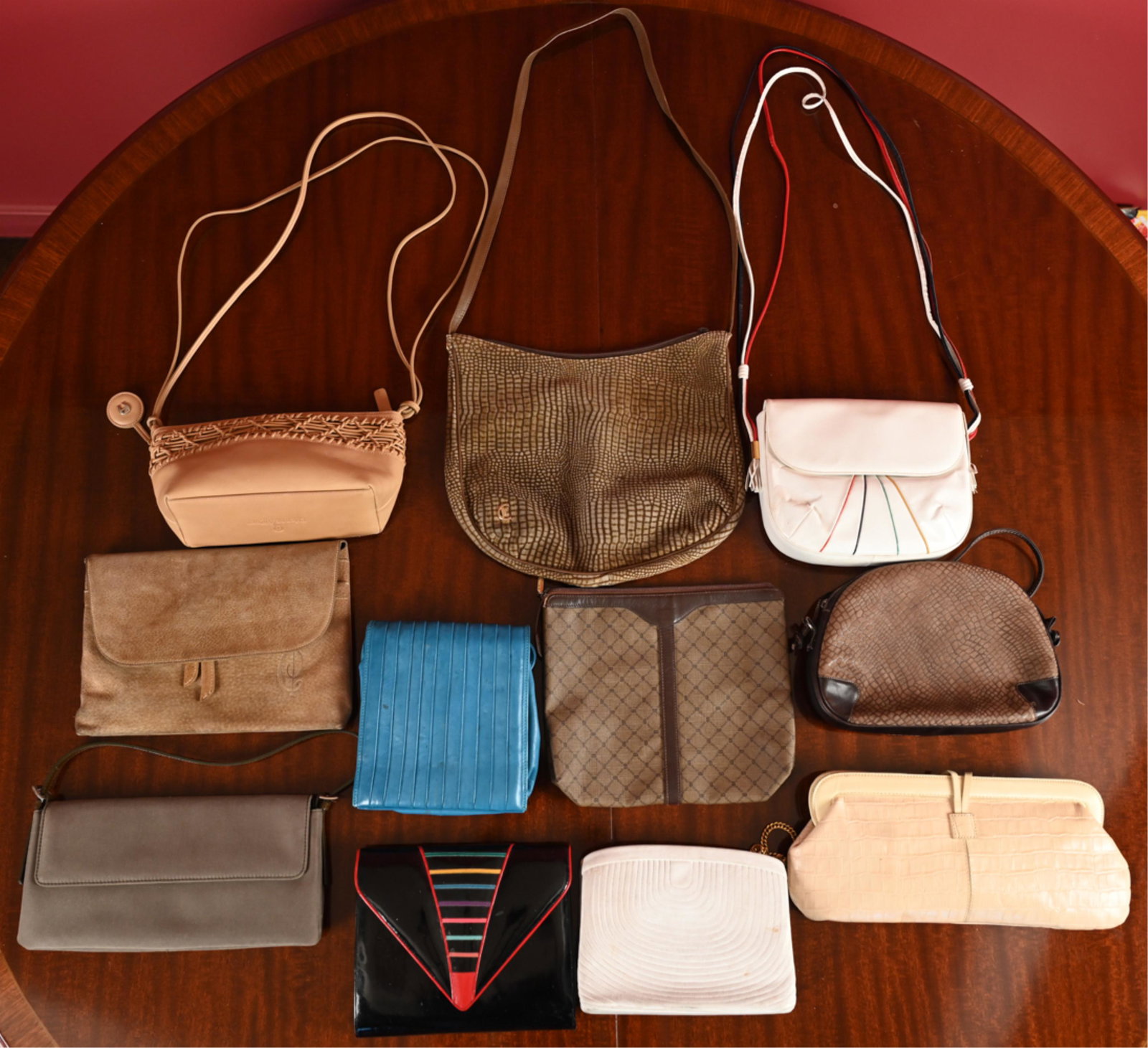 GROUP OF VINTAGE DESIGNER BAGS FOR RESTORATION: (11) bags including Maxx New York, Bruno Magli, Italian, Bloomingdale's, Cesare Piccini, etc. Dimensions: (Largest) H 11" x W 12.5", Strap drop 18.5" Condition: For restoration. Signs of age and use i