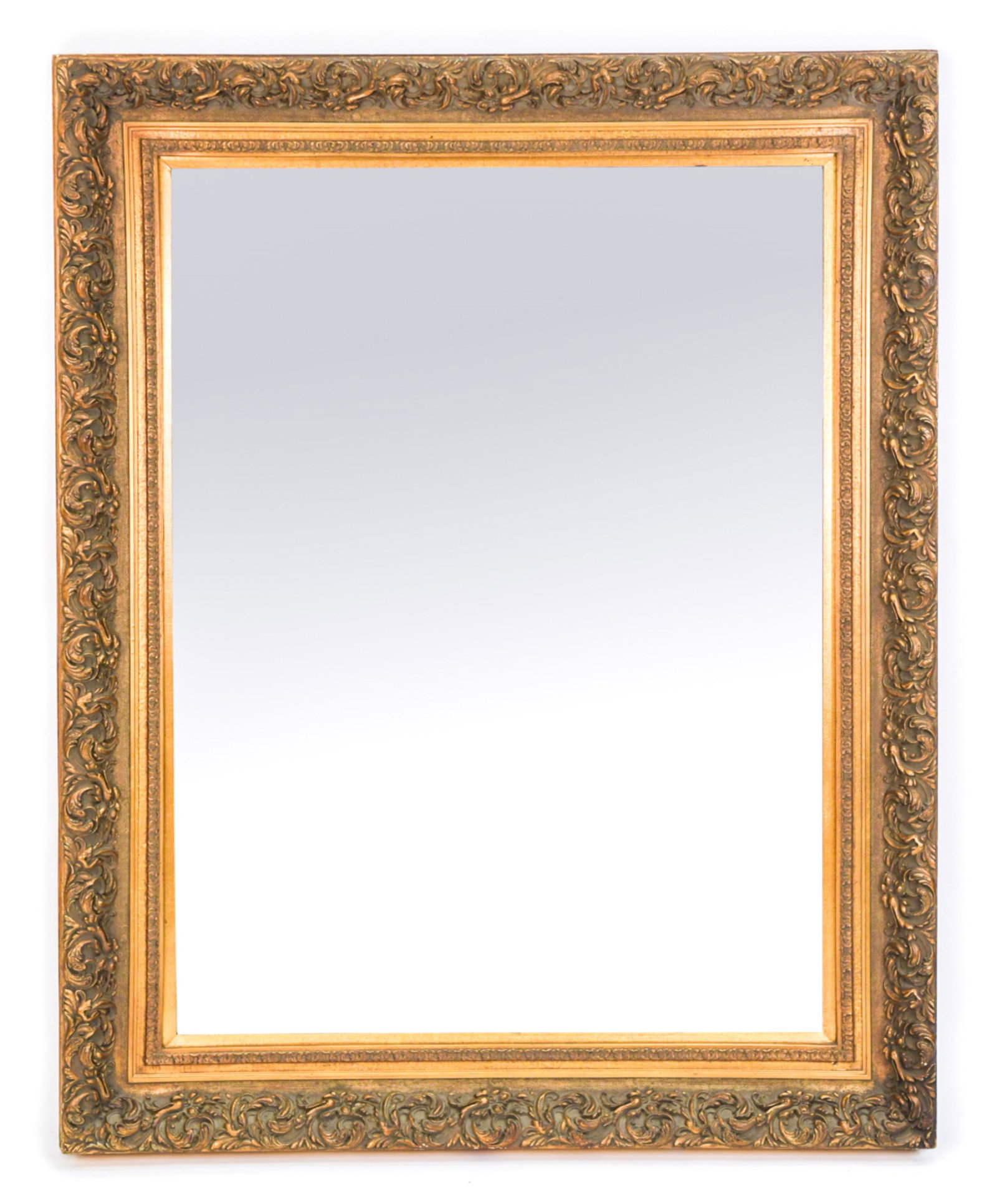 20TH C. ORNATE STYLE FRAME W/ MIRROR: Wide molding, beveled glass. Faux antiqued finish. Dimensions: H 48" x W 60" Condition: Water damage to back of one side. A few stray marks.
