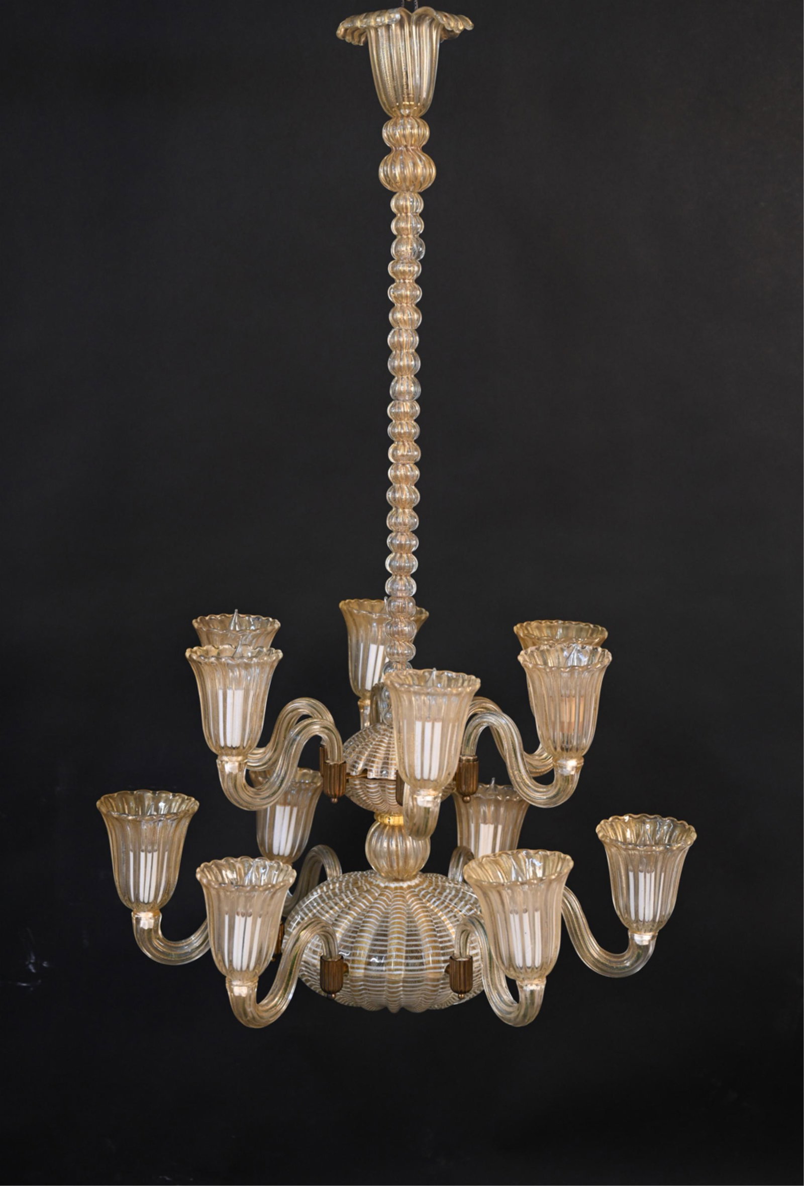 LORIN MARSH ITALIAN ART GLASS CHANDELIER: Gold flecked art glass. 12-light chandelier. Dimensions: H 39" x Dia. 25" Condition: Not tested. Few small chips to glass edges. Some tarnish to metal elements.