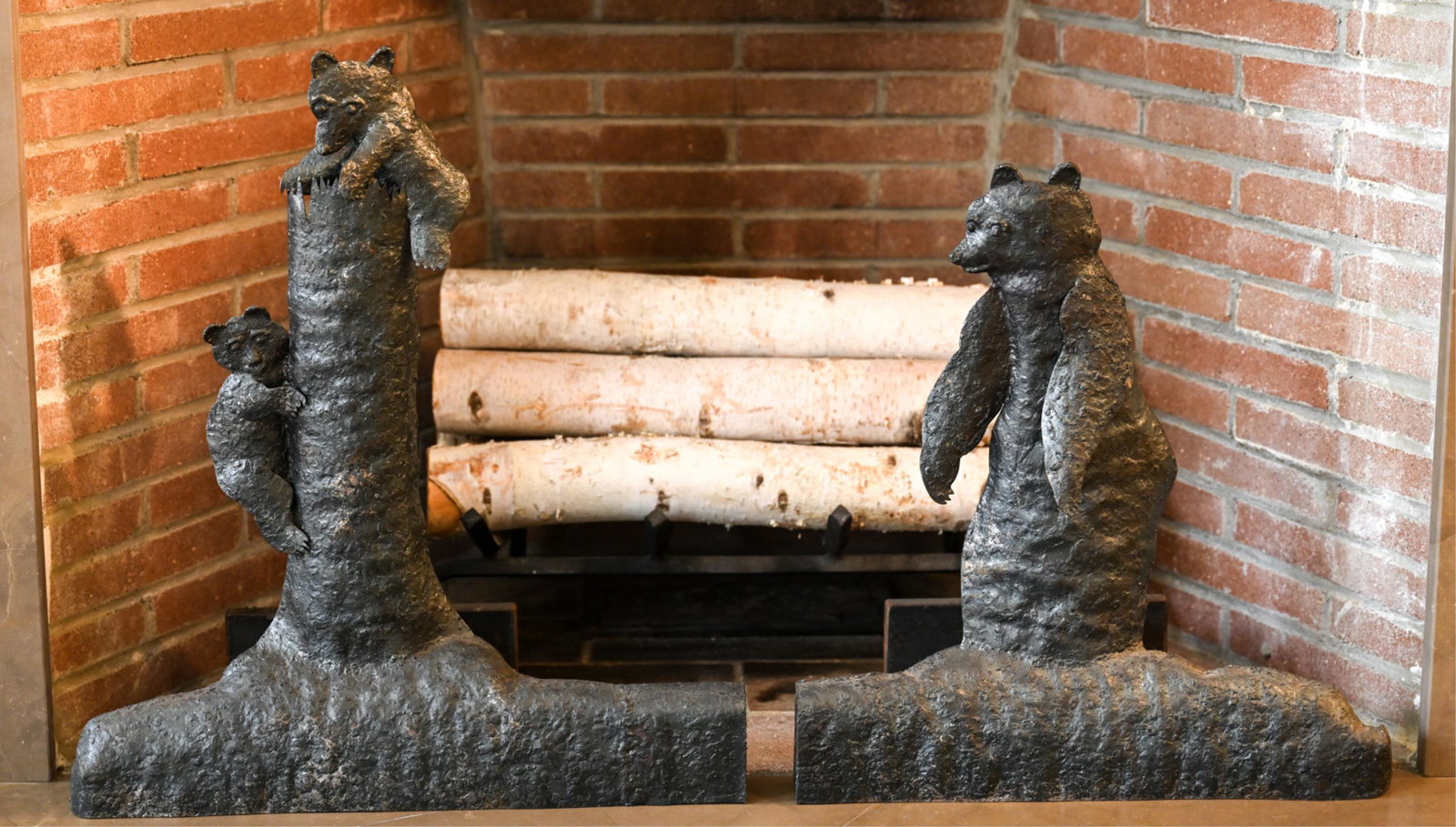 PAIR OF SCULPTURAL BEAR ANDIRONS: Apparently unmarked. Dimensions: (Taller) H 19" x W 17.5" x D 8" Condition: Wear consistent with use.