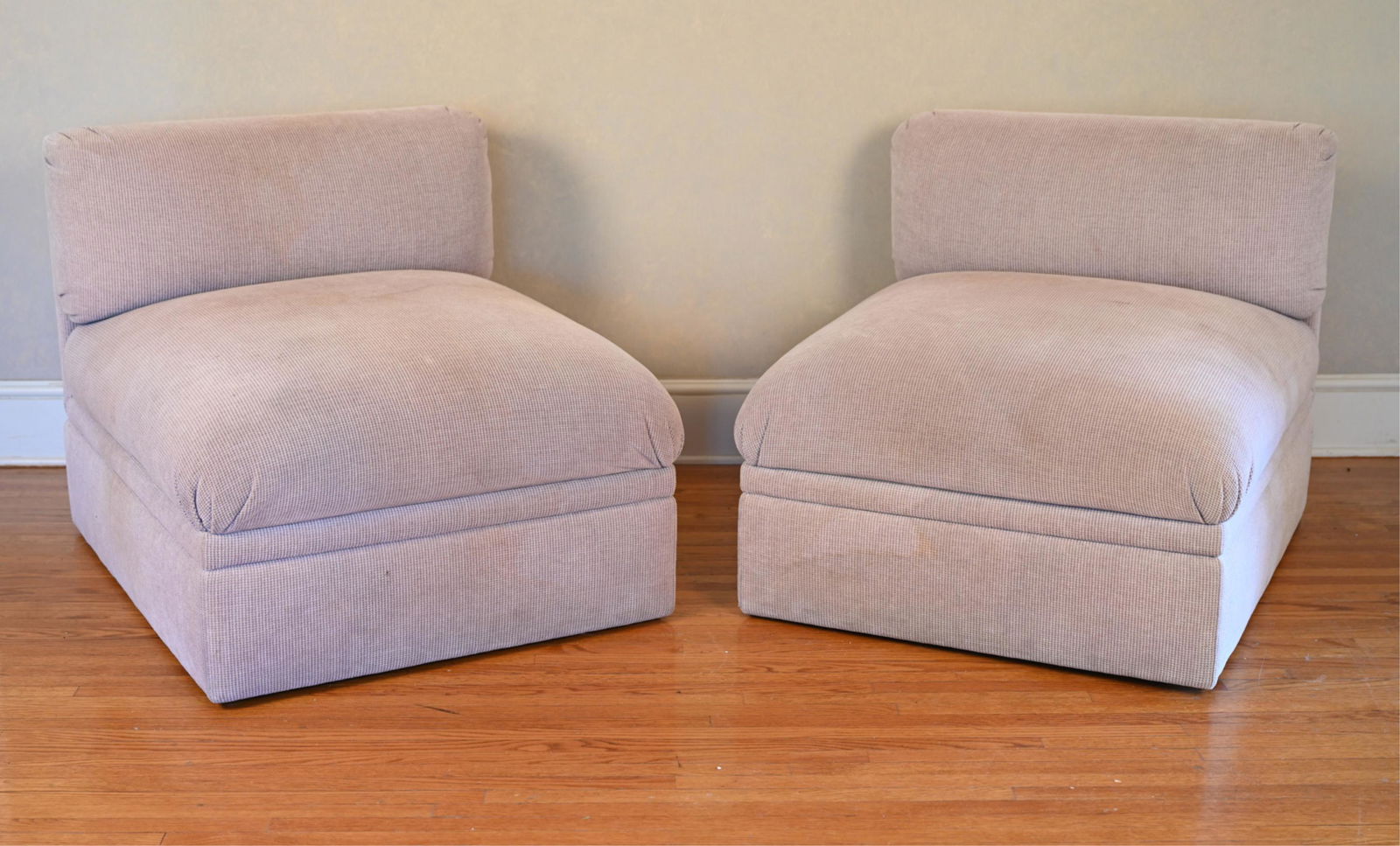 (2) VINTAGE BRUETON MODULAR ARMLESS CHAIRS: Upholstered in lavender woven chenille. Brueton Industries label underneath. Dimensions: (One) H 29" x W 31" x D 39" x SH 17" Condition: Chairs need professional cleaning, restoration, or reupholsteri