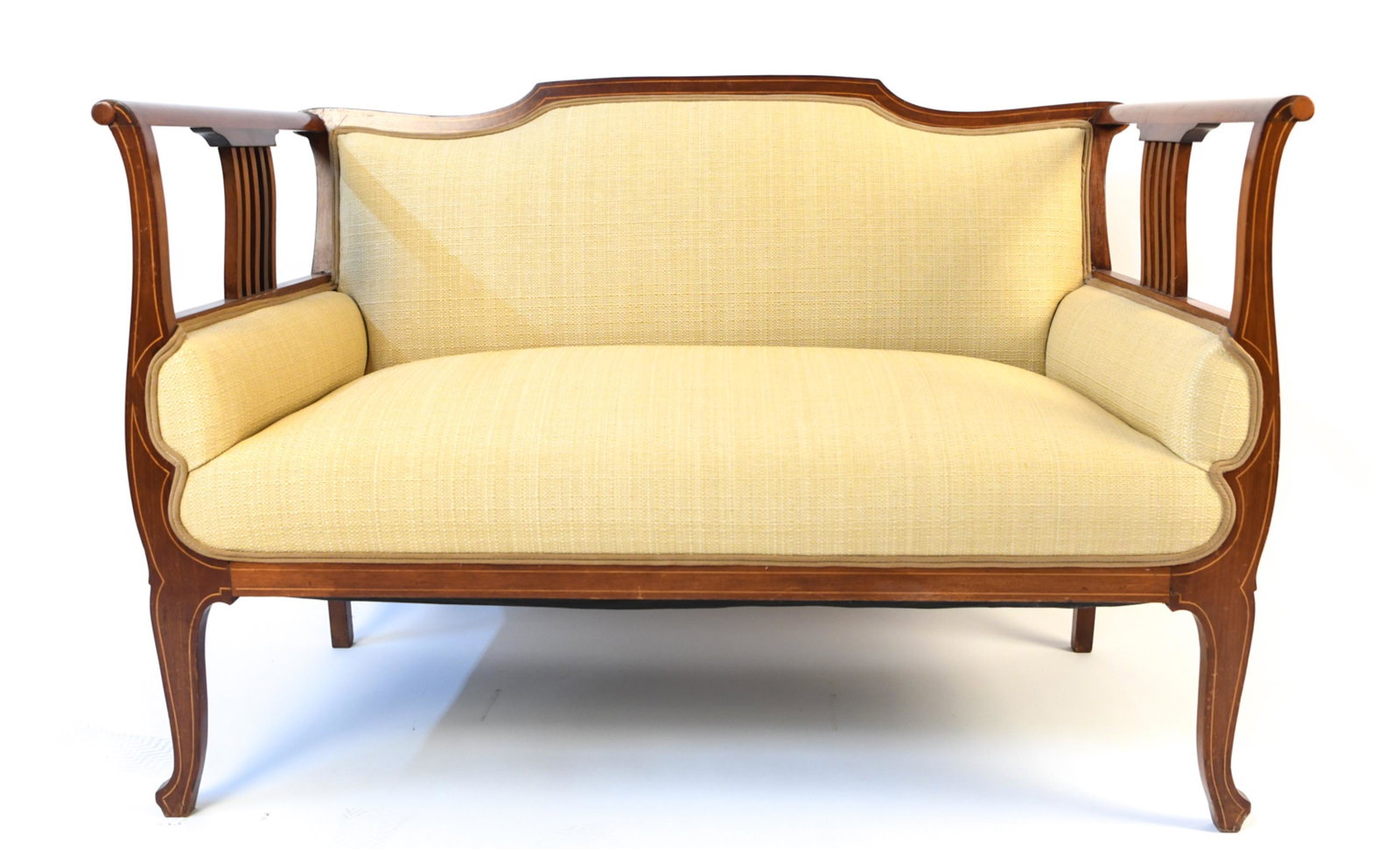 BIEDERMEIER-STYLE INLAID UPHOLSTERED SETTEE: With delicate banded inlay along scrolled arms and legs, upholstered in woven straw. Dimensions: H 32.5" x W 49" x D 24.5" x SH 17" Condition: Showing some wear including a few losses to veneer inlay,