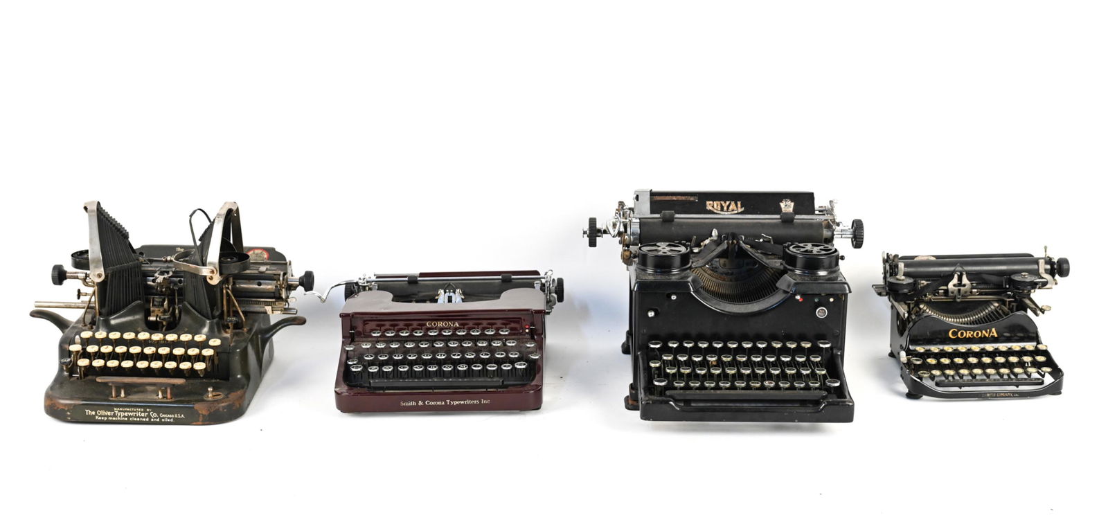 (4) VINTAGE TYPEWRITERS INCL. CORONA: Including (2) Corona, The Oliver Standard Visible Writer No. 5, The Regal Typewriter Co. Royal typewriter. Dimensions: (Largest) H 10" x W 15.5" x D 16" Condition: Not tested. Some dents and small sur