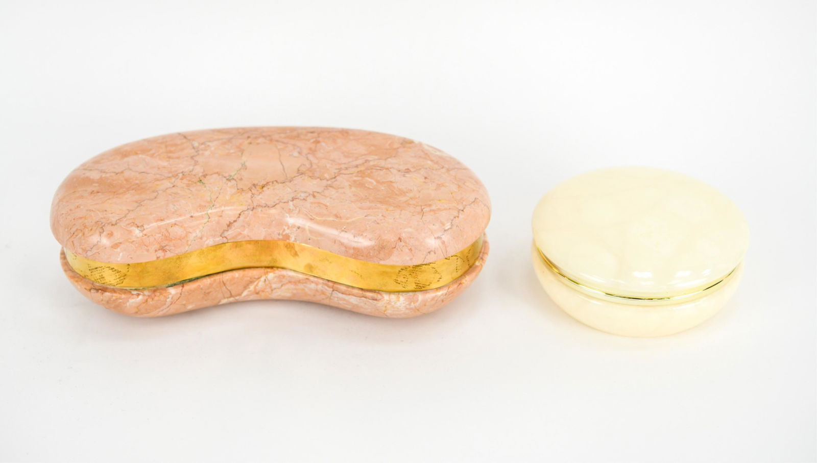 (2) DECORATIVE BOXES INCL. DARA INTERNATIONAL: One kidney shaped marble box with brass detail by Dara International Accessories L.T.D. with original Dara International label under. Circa 1983. Made in Italy. And a genuine hand carved alabaster box