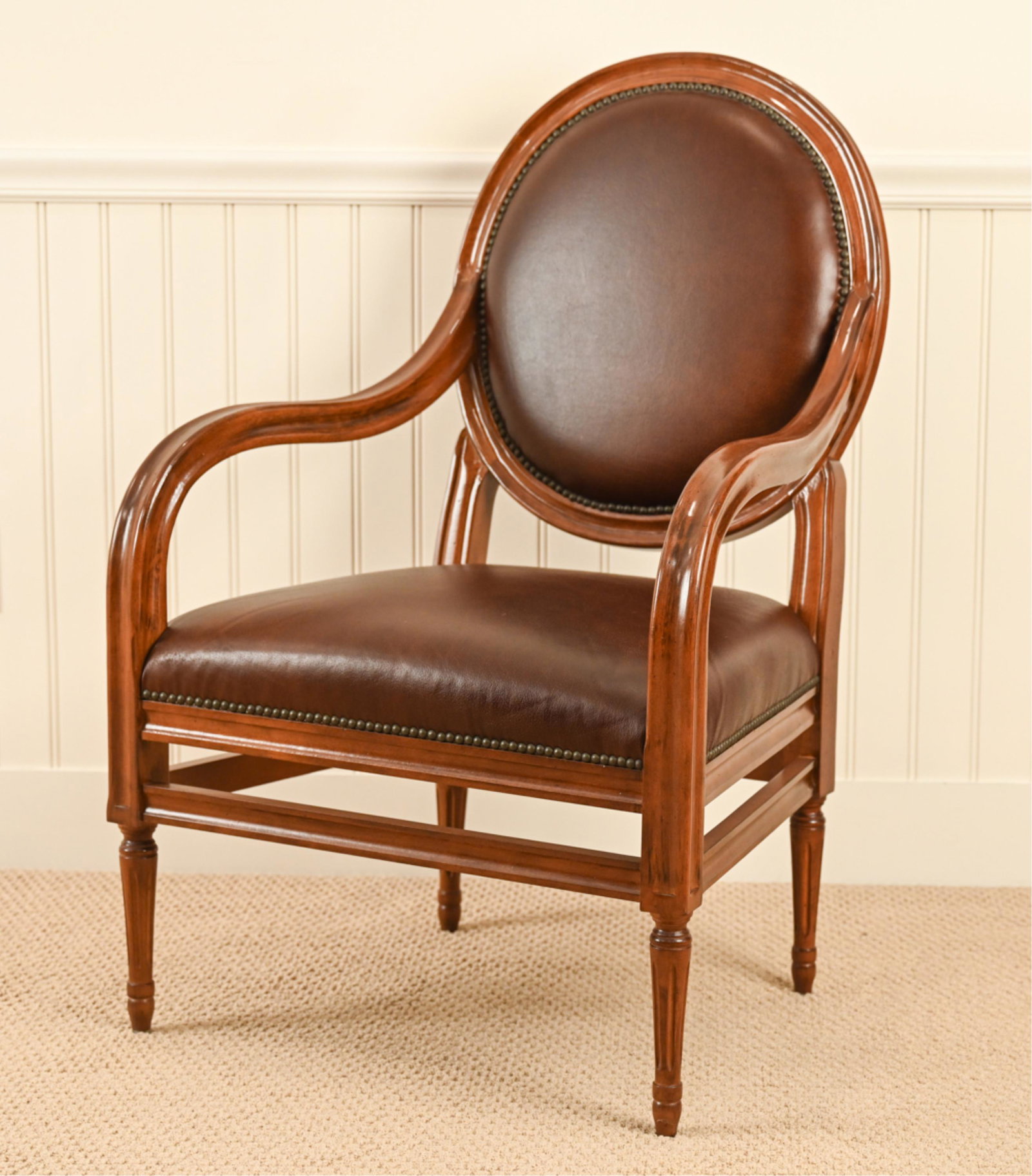 ASTORIA CONTEMPORARY FAUTEUIL ARMCHAIR: Astoria label underneath. Contemporary. Dimensions: H 40.5" x W 26" x D 22" x SH 18" Condition: Some light wear to leather.