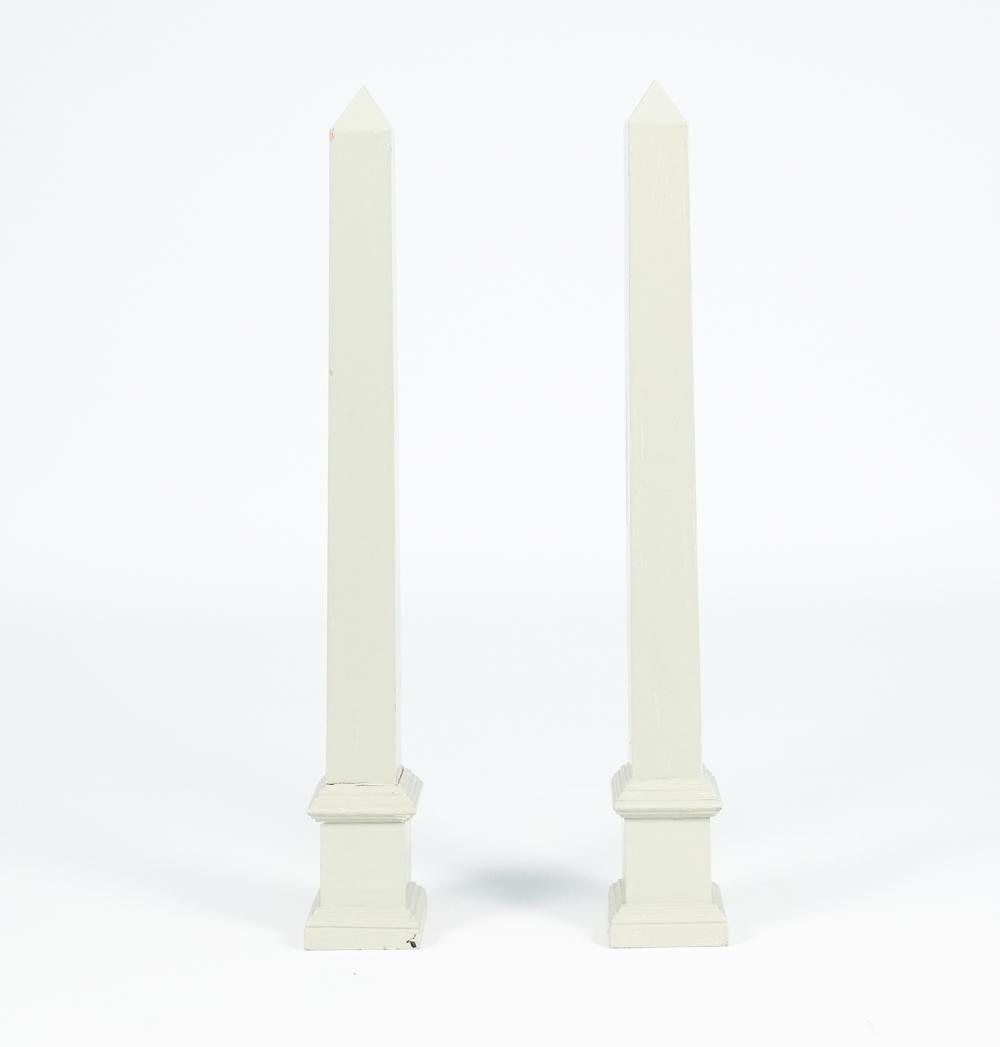 PAIR OF VINTAGE WOOD OBELISKS, PAINTED: (2) Architectural style obelisks, painted light sage green; one labeled Coldwell Alexander underneath. Dimensions: (Each) H 30.5" x W 4" x D 4.25" Condition: One obelisk needs regluing to base; otherw