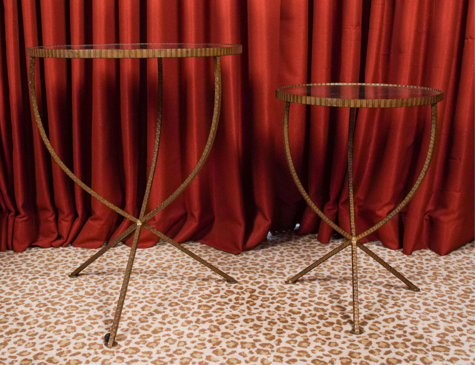 (2) ARTERIORS SIDE TABLES: Wrought iron and antiqued mirrored glass. Dimensions: (Larger) H 27" x Dia. 21" Condition: No issues to note.