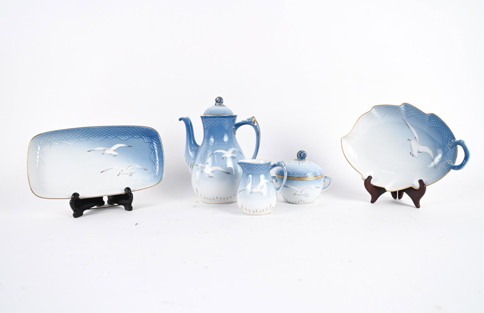DANISH B&G PORCELAIN COFFEE SERVICE: Marked underneath. Includes coffee pot, cream, sugar, and two platters. Dimensions: (Coffee pot) H 9.5" x W 8.5" x D 5" Condition: No issues to note.
