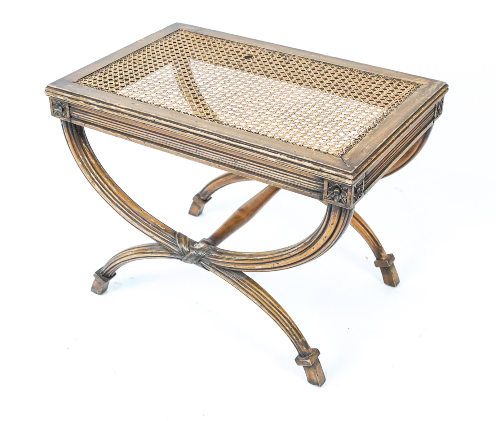 NEOCLASSICAL STYLE CURVED-X BASE CANED BENCH: Dimensions: H 19" x W 25" x D 16.5" Condition: Showing signs of wear including breaks to caning, chips and losses to wood finish.