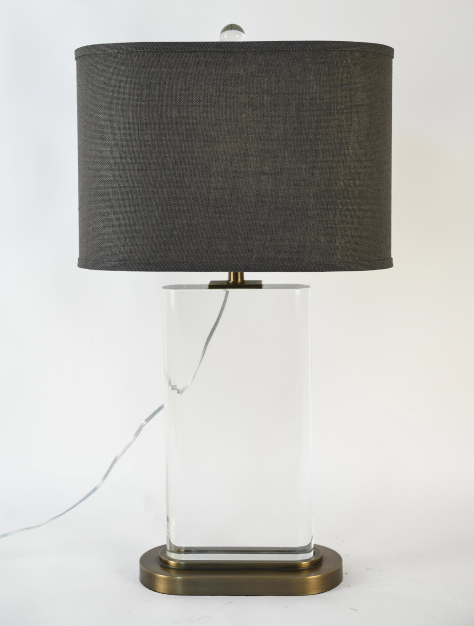 CONTEMPORARY SOLID GLASS & BRASS MONOLITH LAMP: With fitted coffee burlap shade. Dimensions: (Without shade, to finial) H 31" x W 12" x D 6" (Shade) H 12" x W 17.25" x W 9.5" Condition: Not tested. Showing very light wear consistent with use.