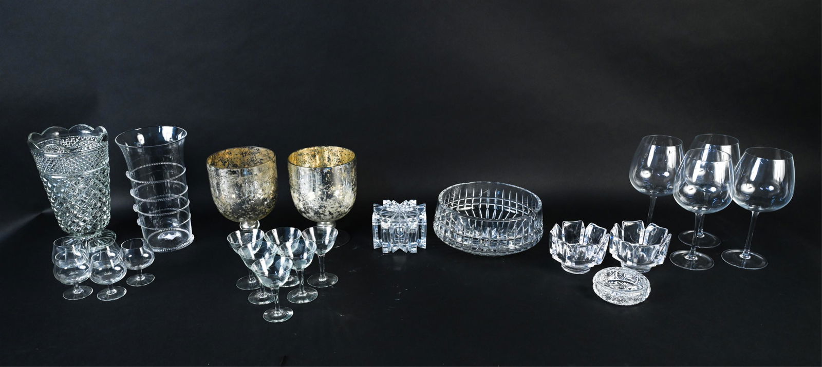 GROUPING OF GLASS INCL. ORREFORS: Including pair of signed Orrefors bowls, large wine glasses, faux mercury glass vases, etc. Dimensions: (Tallest) H 10" x Dia. 5.75" Condition: Few small scattered chips.