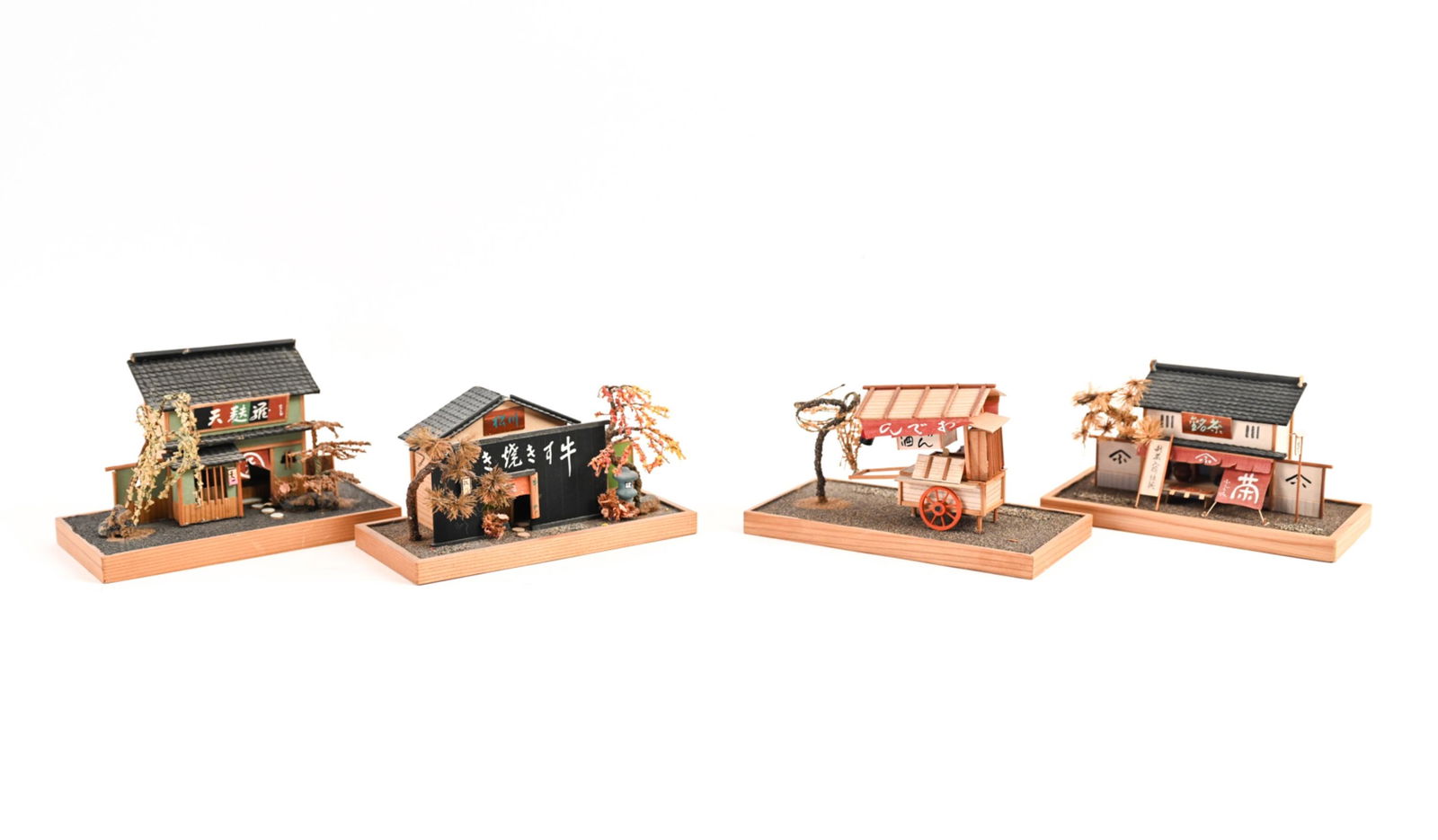 (4) MINIATURE CHINESE BUILDING MODELS: Traditional buildings made out of wood and paper. Dimensions: (Largest) H 3.5" x W 5.75" x D 3.25" Condition: Some wear, small losses.