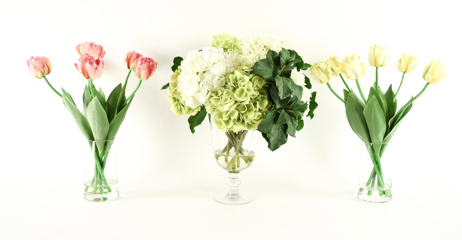 (3) FAUX FLOWER VASE GROUPING: Dimensions: (Largest) H 24" x W 20" x D 20" Condition: Very light wear.
