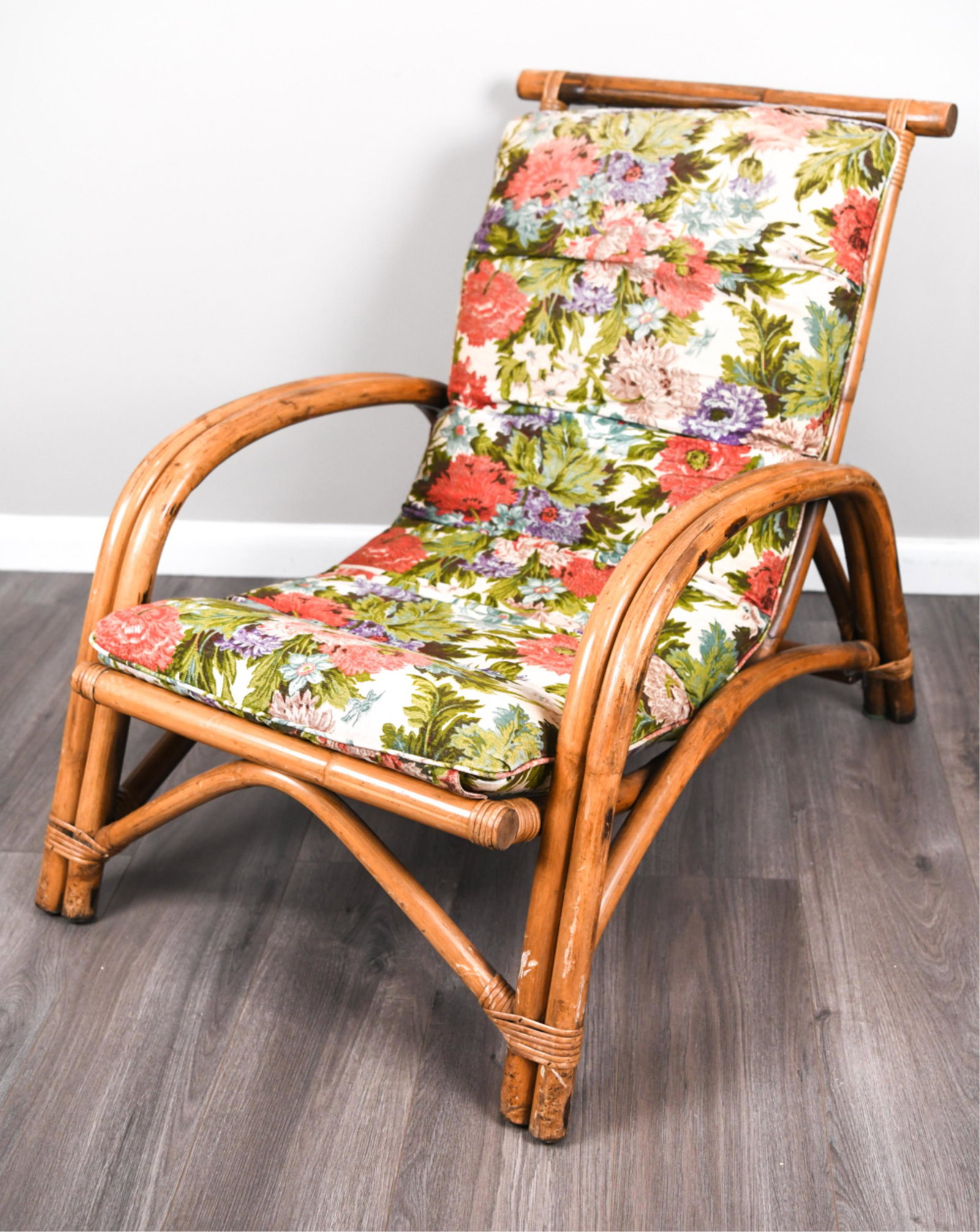 BAMBOO / RATTAN LOUNGE CHAIR: Dimensions: H 31.5" x W 40" x D 26.5" SH 15" Condition: Scratches and scuffs though out. Break to one of the seat supports. Uncoiling to bottom right hand corner.