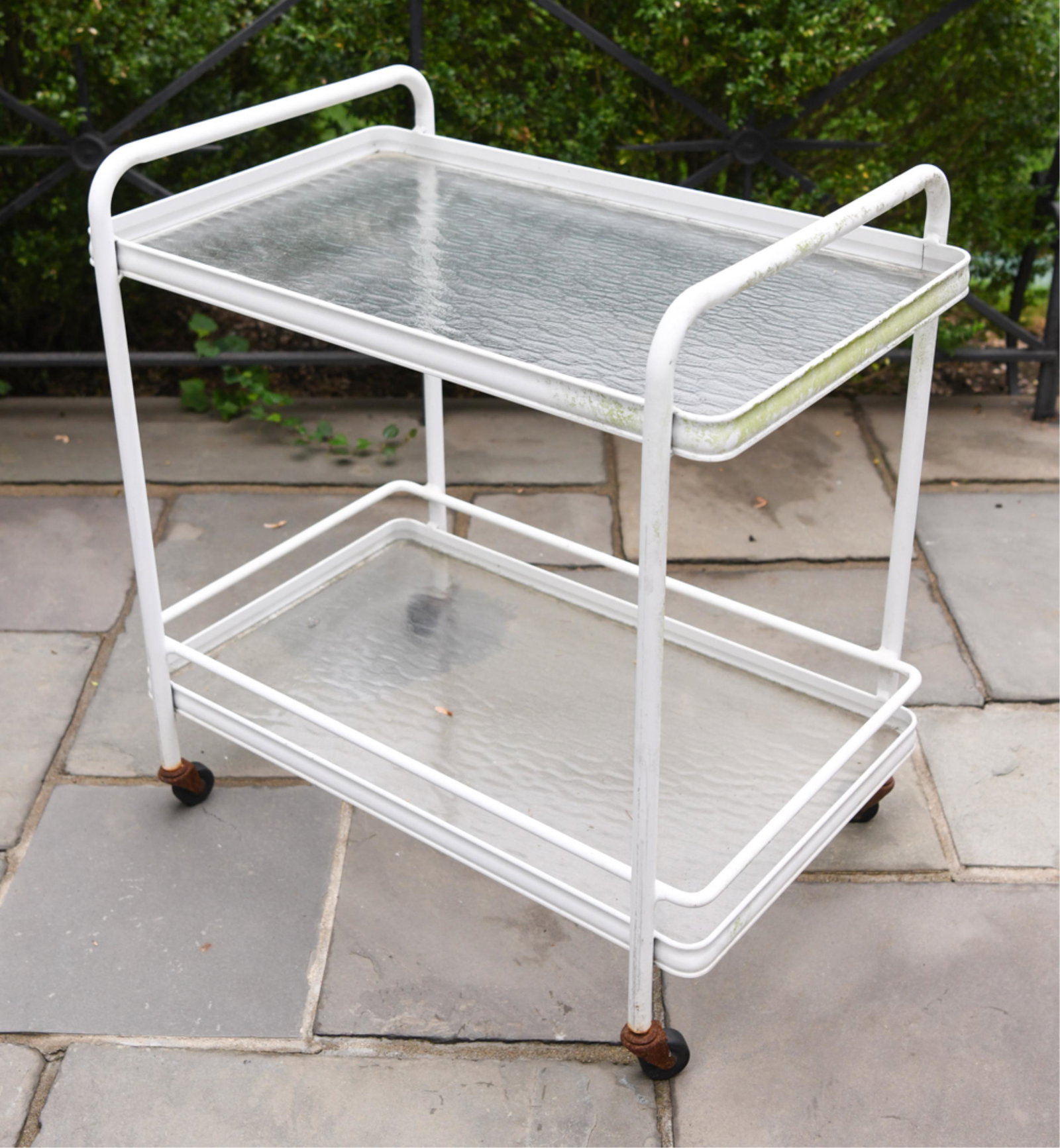 OUTDOOR ROLLING BAR CART: With two removable glass shelves. Dimensions: H 32" x W 31" x D 20.5" Condition: Some scratches and scuffs to paint. Heavy rusting to wheels. Could use a light cleaning.