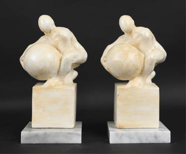 PAIR OF TOM OTTERNESS PAINTED PLASTER BOOKENDS: 1979. Unmarked. Dimensions: (Incl. marble base) H 9" x W 4.5" x D 4.5" Condition: White paint with faux antiquing over.