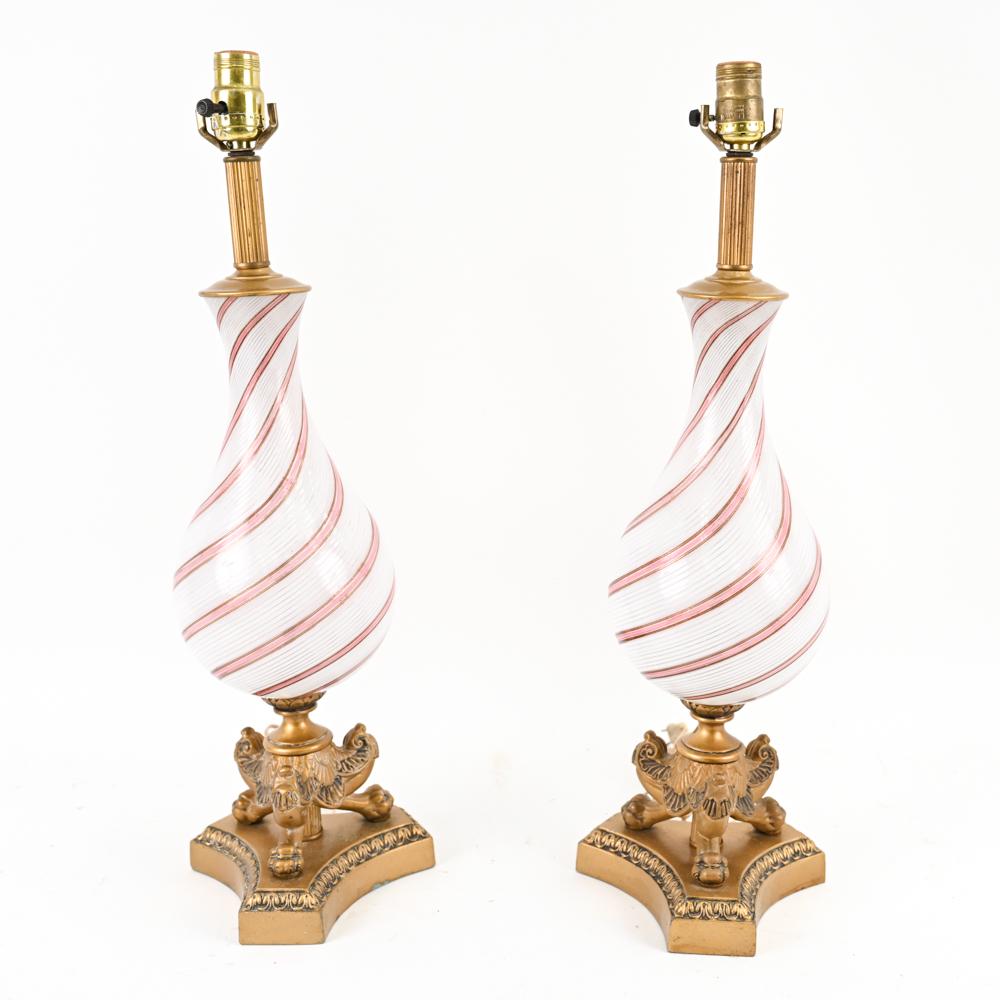 PAIR DINO MARTENS FOR AURELIANO TOSO GLASS LAMPS: In white spiraling filigrana accented by pink and gold filigrana. Dimensions: H 25" x D 8" Condition: Showing overall light wear consistent with normal use.