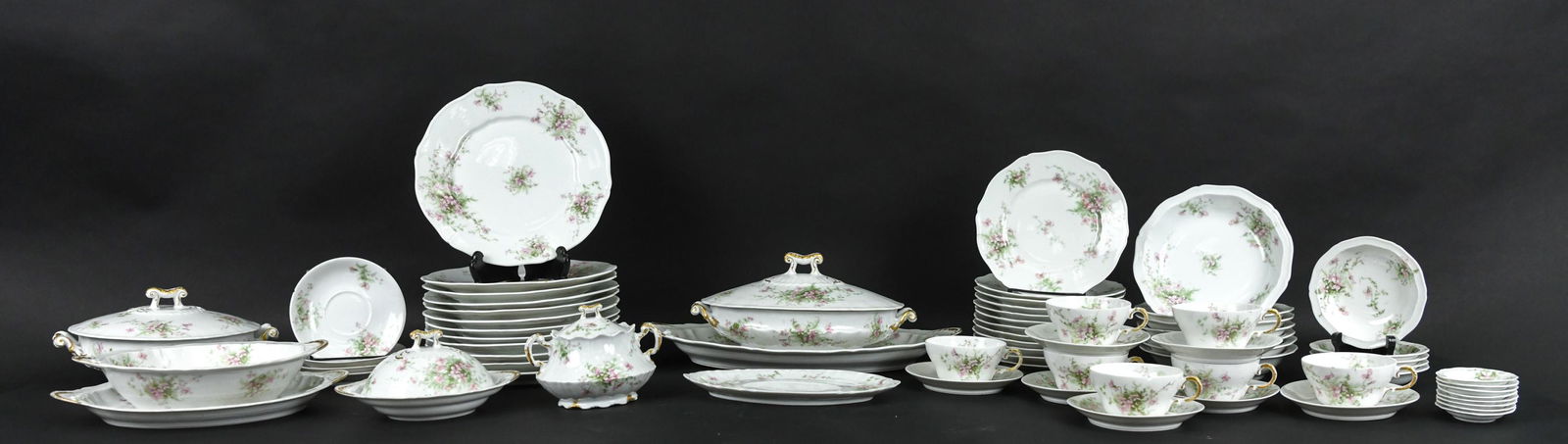 ANTIQUE (71) PC. HAVILAND LIMOGES DINNER SERVICE: (71) Pieces of Theodore Haviland dinner and serveware dating from the early 20th century. Pattern features flourished edges with delicate pink floral spray motif. Marked Theodore Haviland Limoges Fran