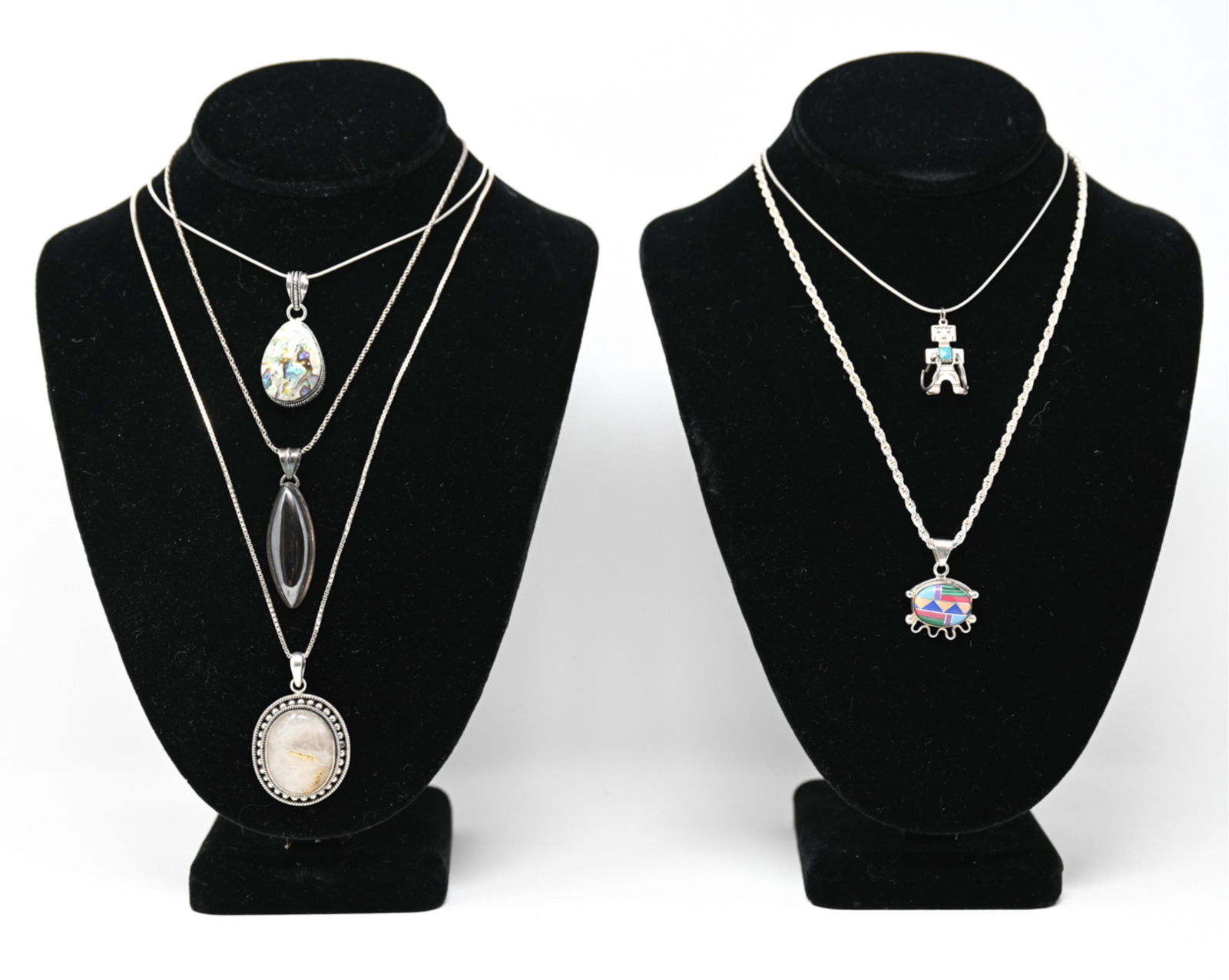 STERLING SILVER & STONE JEWELRY: (5) necklaces, all with semiprecious stones including hematite, abalone, turquoise, rutilated quartz, etc. Some Native American. Dimensions: Quartz pendant: H 2" x W 1.25" Longest necklace: 28.5" Weig