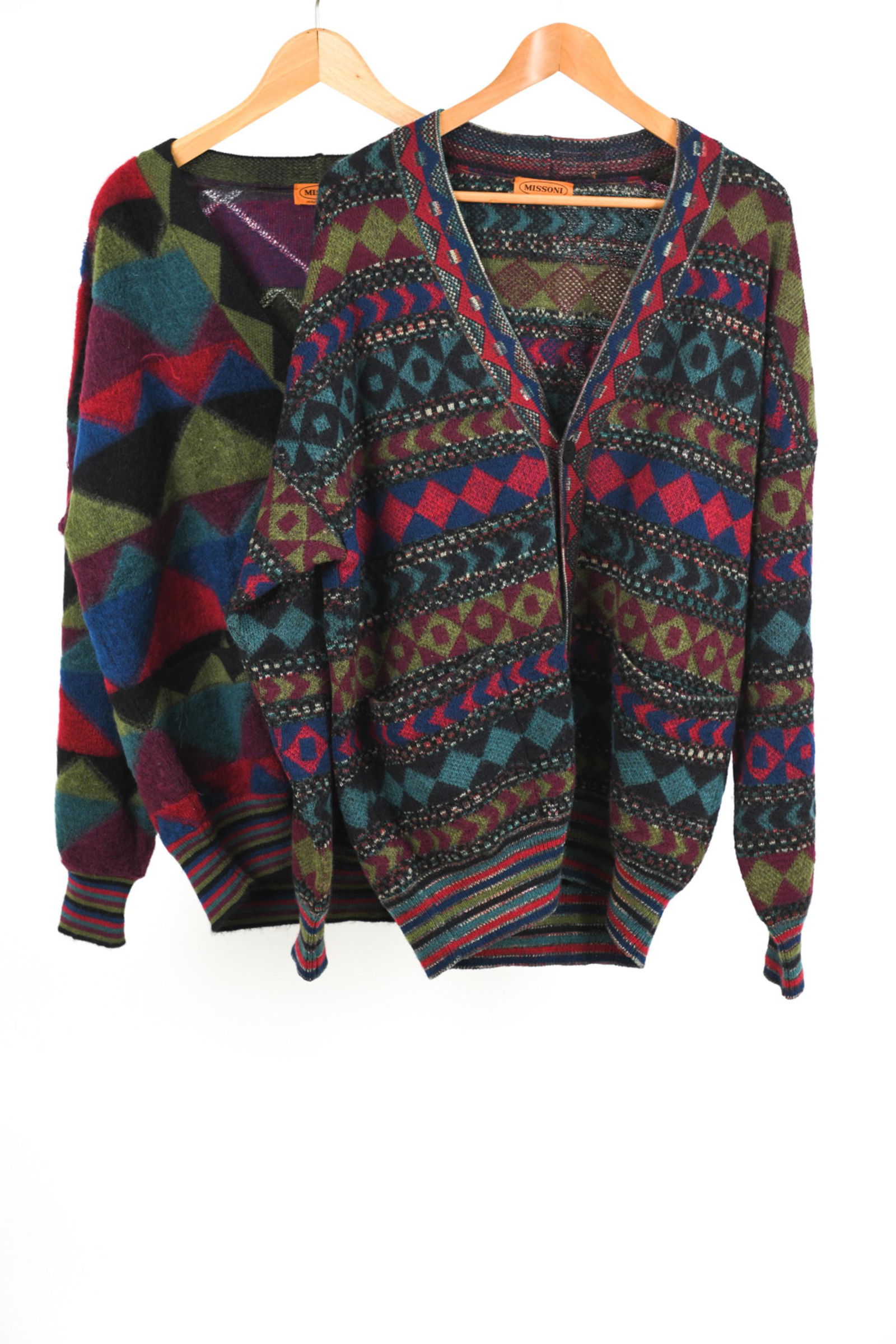 (2) 1970'S/80'S MISSONI MOHAIR BLEND CARDIGANS, L: (2) Fabulous Missoni cardigans dating from the late 1970's- early 1980's, featuring soft mohair-blend yarns colorful geometric patterns, and striped waistbands and cuffs. Both size IT 50. Condition: I