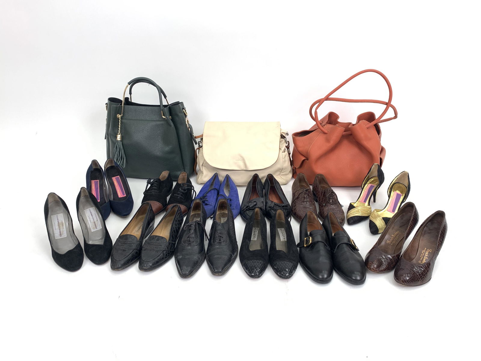 LARGE GROUPING VINTAGE DESIGNER SHOES & BAGS: Large lot including (3) leather bags - Borse en Pelle, Unisa, and Bruno Rossi - and (12) pairs of shoes, mostly size 6 -6.5, including Susan Bennis-Warren Edwards heels and Fratelli Rossetti loafers.
