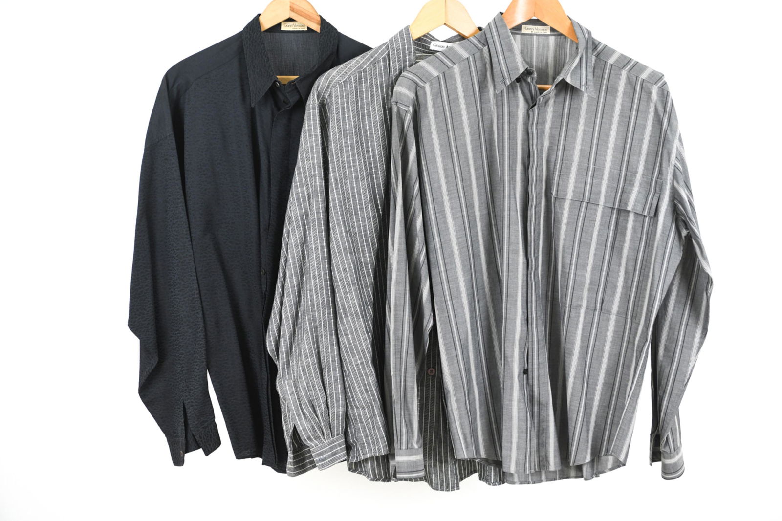 (3) 1970'S/80'S VERSACE & GIORGIO ARMANI SHIRTS: Grouping of (3) endlessly stylish long sleeve shirts from the 1970's-1980's, including: 1970's Gianni Versace grey striped poplin button down, size IT 48 / M; late 1970's Gianni Versace black shirt wi