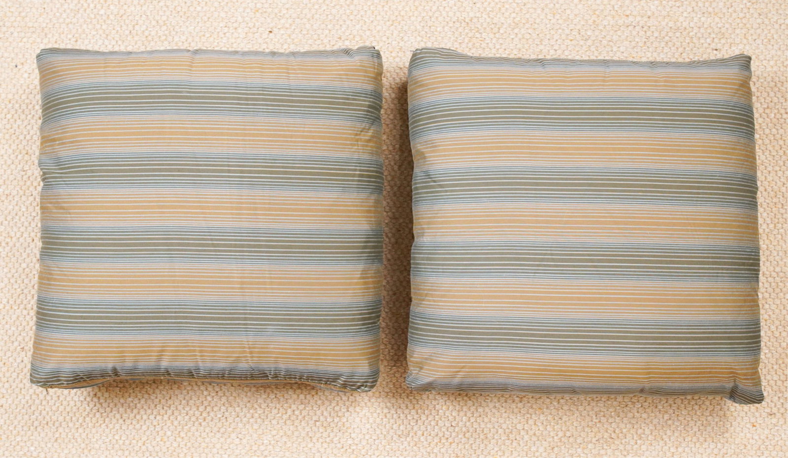 PAIR OF PINSTRIPE THROW PILLOWS: Polyester fiber stuffing. Dimensions: H 19" x W 19" Condition: No issues to note.
