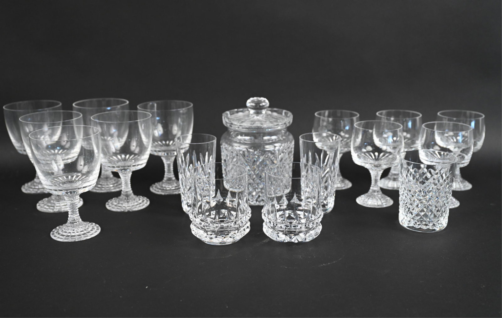 GROUPING OF CRYSTAL GLASSWARE INCL. ROSENTHAL: Grouping of cut crystal glassware, including: (4) water goblets and (5) red wine glasses from the "Polaris" pattern by Rosenthal; (2) Rosenthal "Holdfast" lowball glasses; (1) Waterford covered honey 