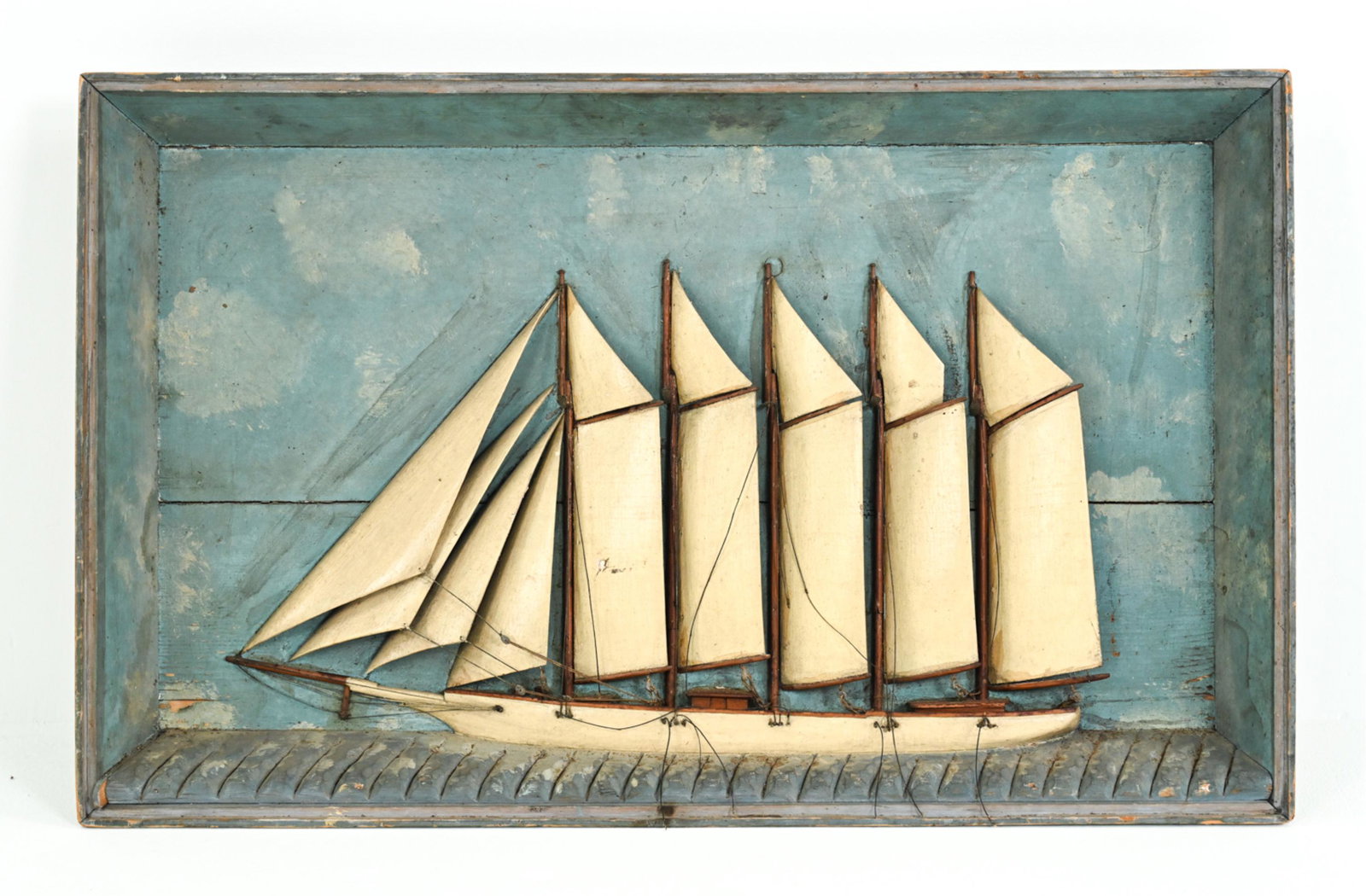 FOLK ART CARVED WOOD 5-MASTED SCHOONER DIORAMA: Fantastic painted wood diorama of a 5-masted schooner ship in relief, with twine lines, apparently unsigned. Dimensions: H 22" x W 36" x D 4.5" Condition: In need of some restoration; many lines broke