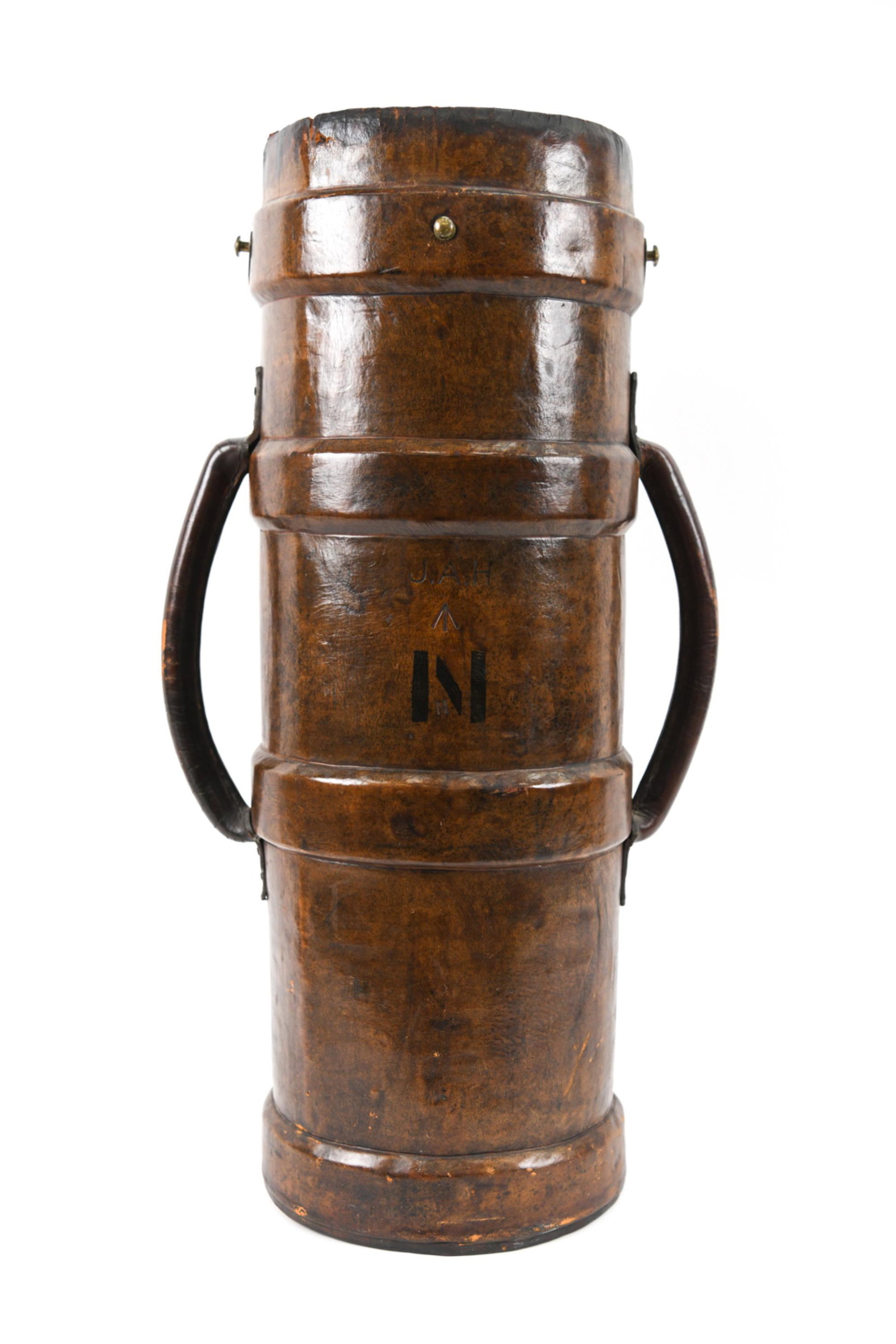VINTAGE LEATHER AMMUNITION BUCKET: Vintage monogrammed two handled cylindrical leather ammunition bucket. Brass hardware. Rich patina to leather. Canvas inside. Would make a unique umbrella stand or cane holder. Dimensions: H 28.25" x 