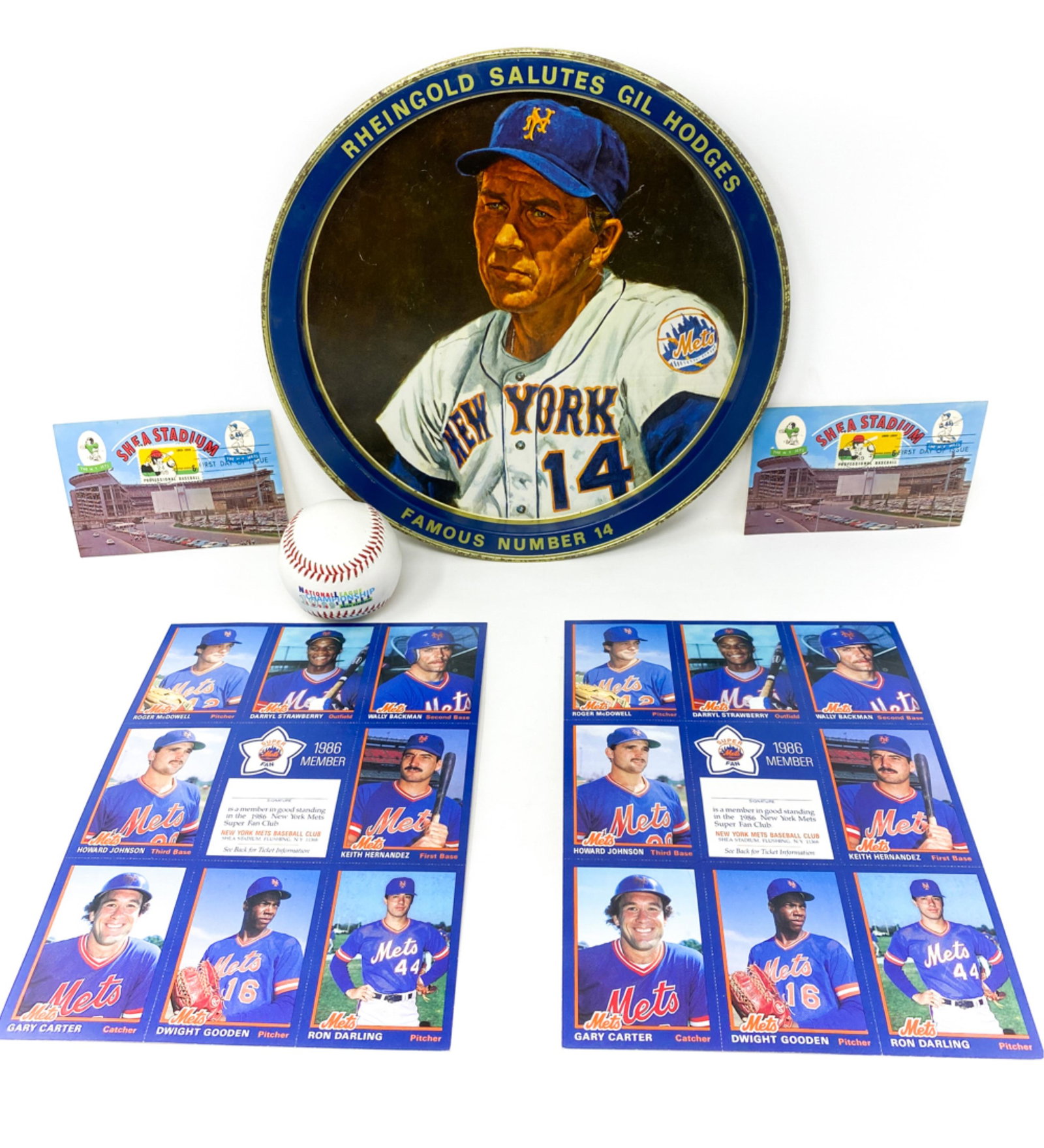 METS SUPERFAN COLLECTION: Collectible "Salute to Gil Hodges tray, Mets 1986 super fan card sheet, and 1960's postcards. 1999 championship series baseball. Dimensions: H 1" x D 12" Condition: Tray showing signs of use. Cards in