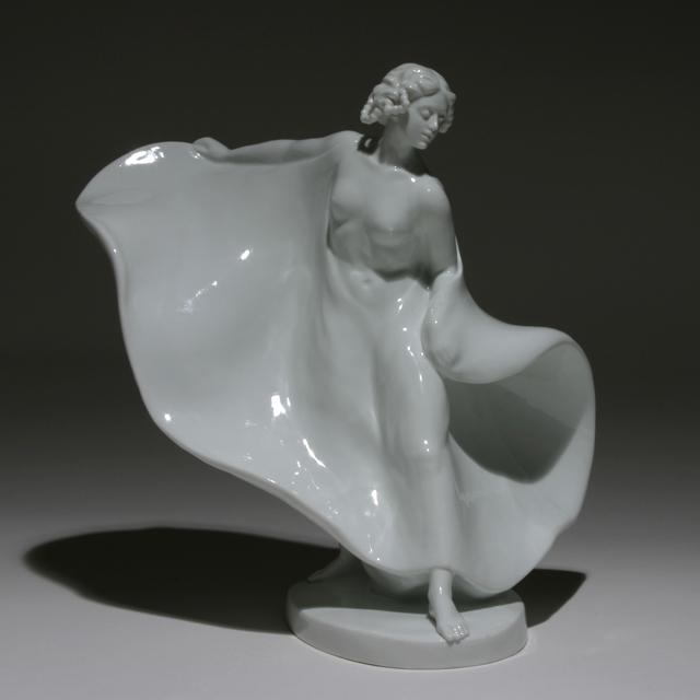THEODOR EICHLER FOR MEISSEN PORCELAIN FIGURE: The Dancer Loie Fuller. Designed 1911 for Porzellan Manufaktur Meissen. Germany, c. 1929. Porcelain. Painted maker’s mark to underside. Impressed with model no. "B. 255." and no. "42". Literature: S