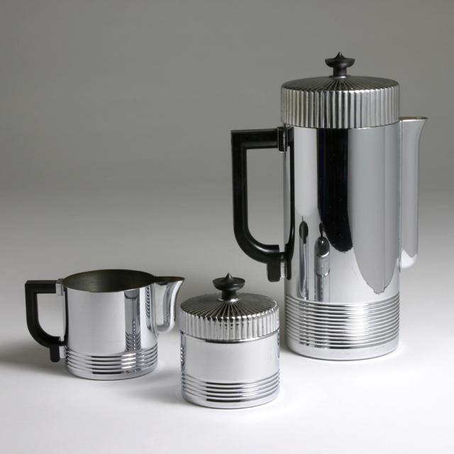 WALTER VON NESSEN "CONTINENTAL" COFFEE SERVICE: "Continental" coffee set. Manufactured by Chase. USA, c. 1934. Comprising a coffee pot, sugar bowl, creamer. Steel, Bakelite. Each piece stamped with "Chase U.S.A." Literature: J. Stewart Johnson, Ame