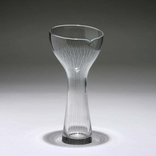 TAPIO WIRKKALA FOR IITTALA GLASS VASE: Vase. Made by Iittala, Helsinki. Finland, 1958. Glass. Engraved on the underside: TAPIO WIRKKALA IITTALA -58. Dimensions: H 10.75" x Dia. 5" Condition: Small chips to bottom rim, surface scratches und