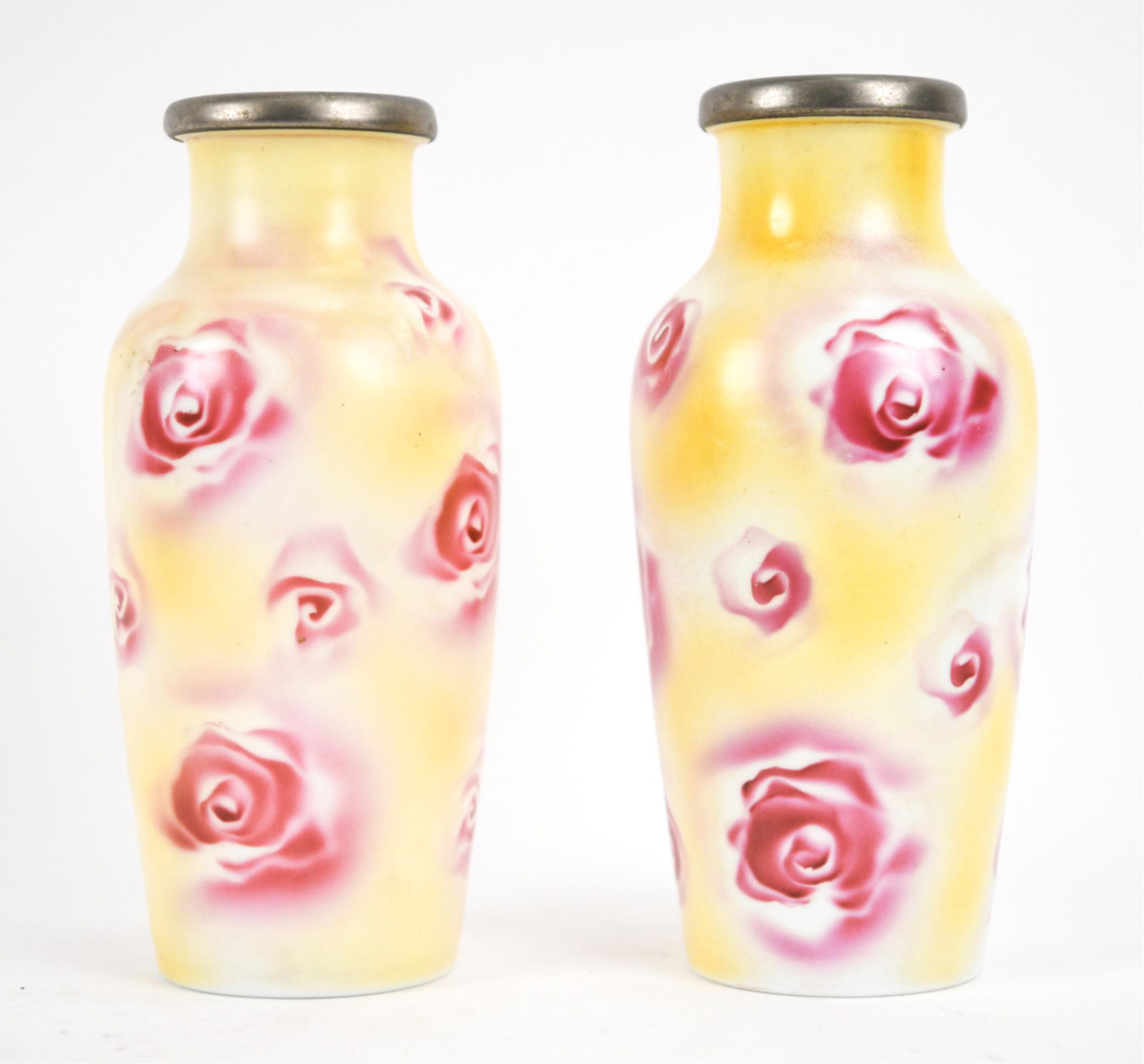 PAIR OF MILK GLASS VASES WITH SATIN FINISH, 1940'S: Pair of opaline glass vases with yellow and pink satin rose finish and metal collars, apparently unmarked. Dimensions: H 9.5" x Dia. 4.25" Condition: A few tiny scuffs and rubs to glass, dullness to m
