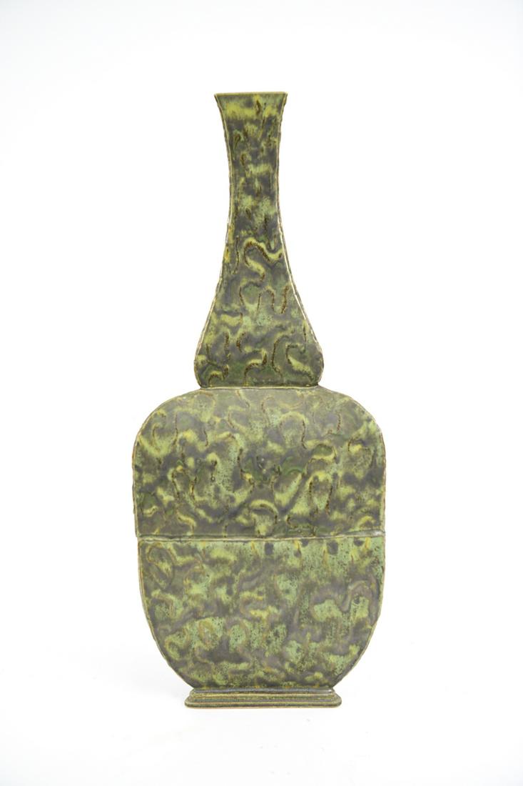 TRIANGULAR GREEN VASE: Triangular green vase with unique flat green and brown glaze. Dimensions: H 23" x W 9" x D 8" Condition: Overall the vase is in very clean condition. No marks, rubs or wear. Bottom is clean and is mar