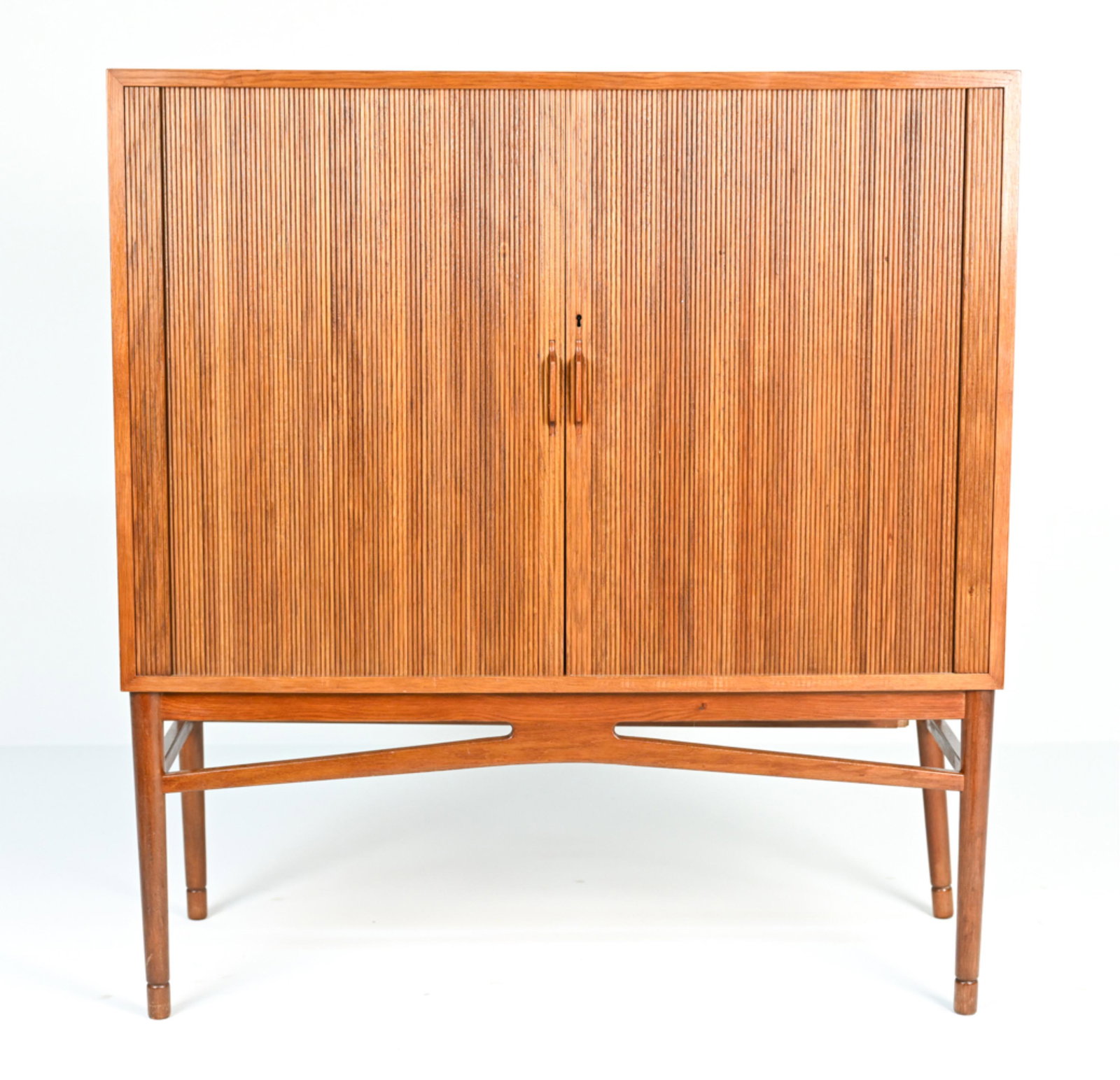 DANISH HIGHBOY TAMBOUR CABINET: Highboy cabinet with tabour doors and adjustable tray system on the interior. quality box joint construction on internal trays. Dimensions: H 44" x W 41" x D 18" Condition: Varnish shows minor crackli