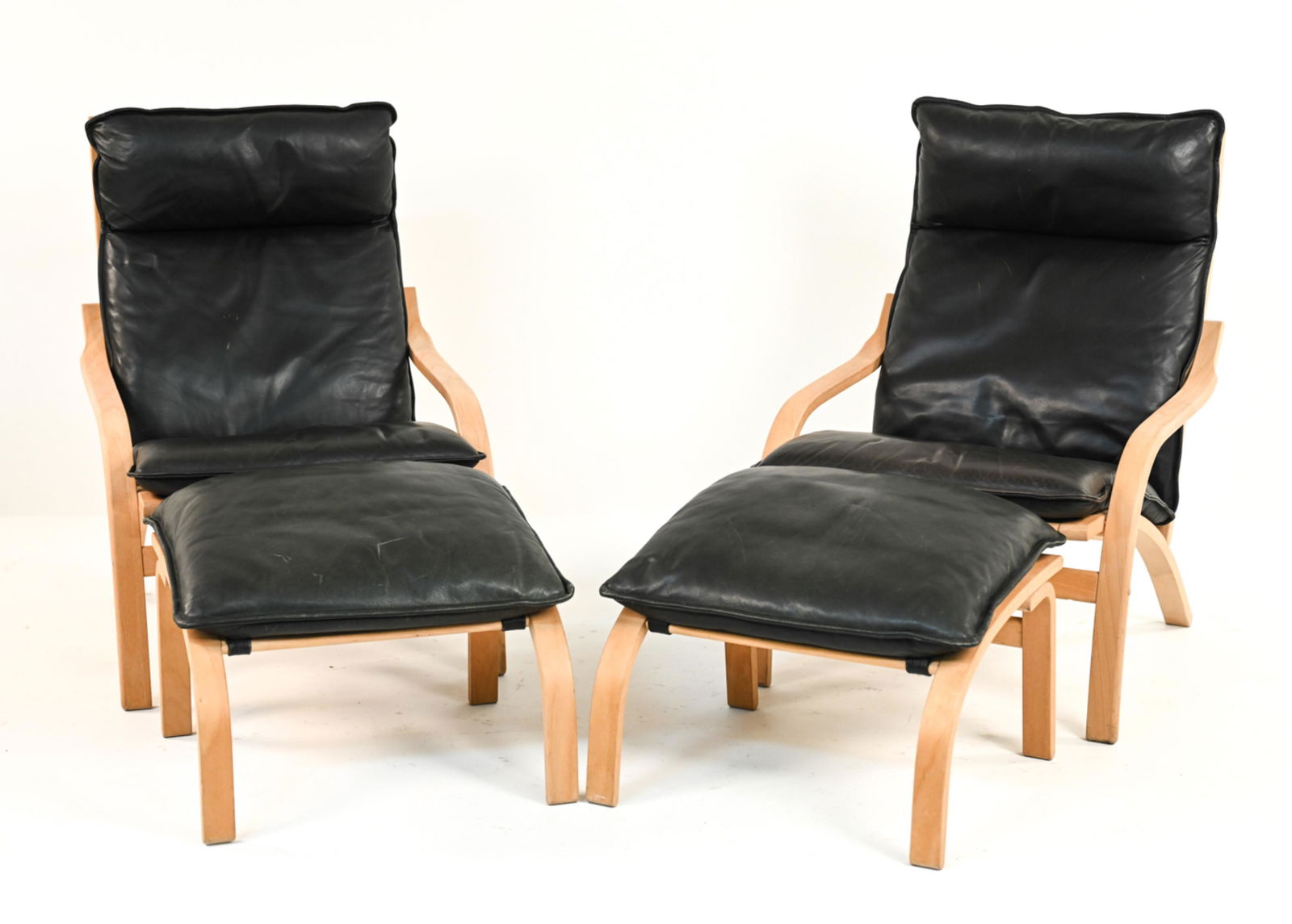 PAIR OF MOGENS HANSEN LOUNGE CHAIRS & OTTOMANS: Dimensions: (Chair) H 37" x W 26.5" x D 33" x SH 18" Condition: Wear consistent with age and use. Minor wear to leather, scratches to wood frame. One ottoman missing a bolt. GC012