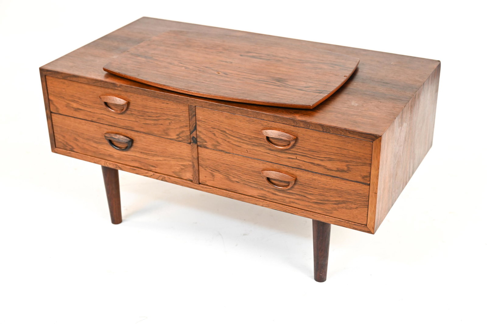 KAI KRISTIANSEN ROSEWOOD CREDENZA WITH SWIVEL TOP: Small Danish rosewood veneer credenza with swivel top. Dimensions: 17.75" x W 38.75" x D 18" Condition: Drawers have dovetail joinery and are constructed with maple sides and pine bottoms. Back is sti