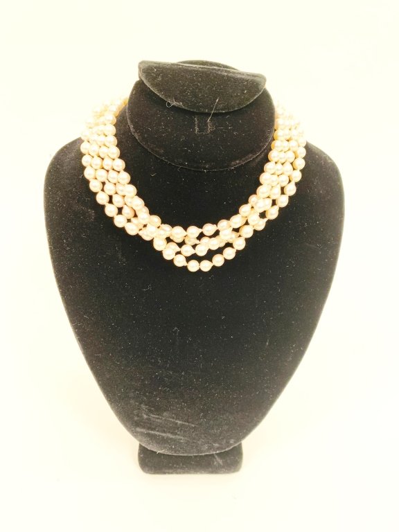 PEARL & ROUGH CUT DIAMOND NECKLACE: A four strand pearl necklace with 14k yellow gold and diamond clasp. Choker length. Rough cut diamonds are visibly included, the largest measuring 4mm in diameter. 9 diamonds on each side, 3 sided cla