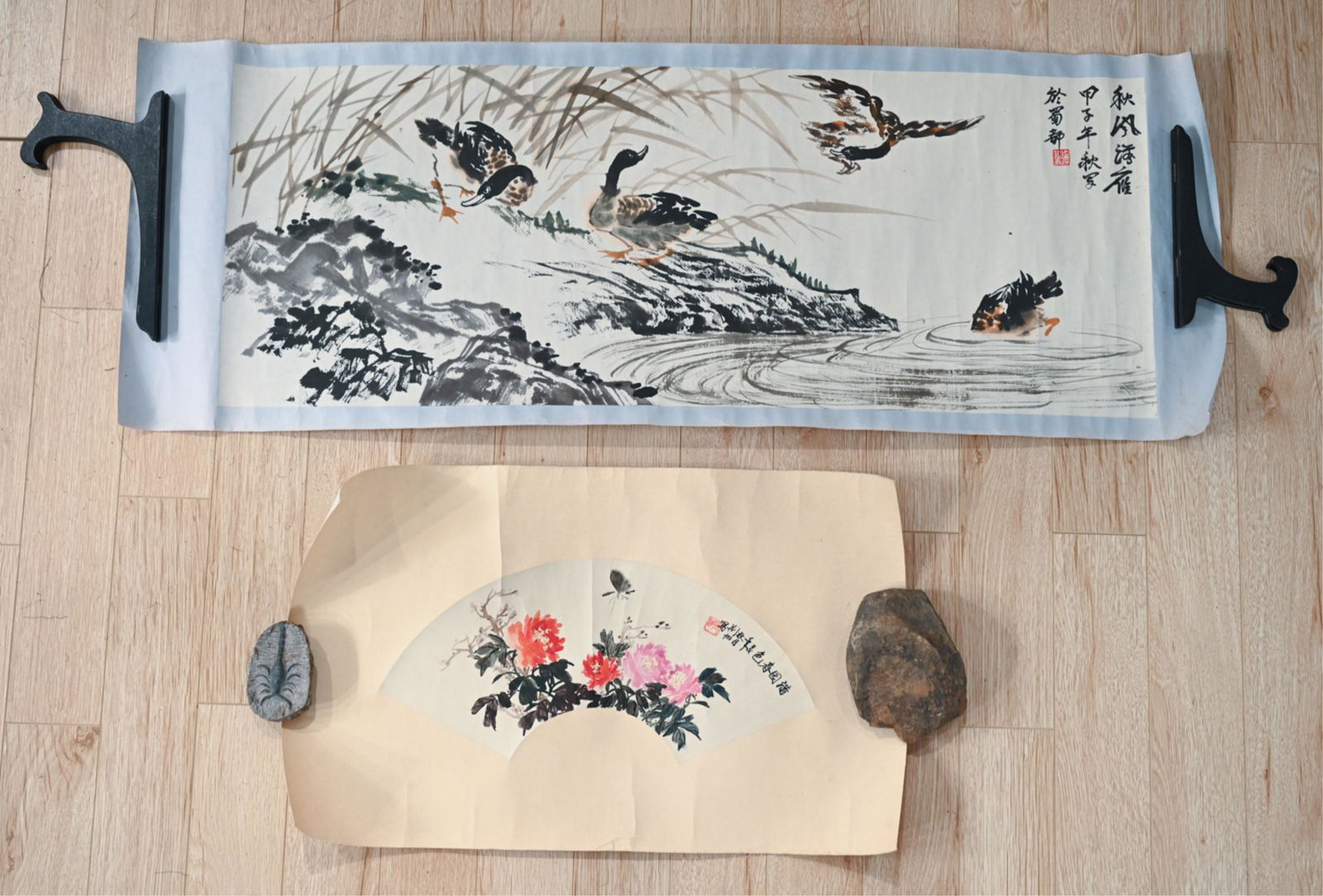 (2) CHINESE SCROLLS: Dimensions: (larger) H 15.25" x L 42.5" Site H 13.5" x W 36" Condition: Previously rolled with creases to paper and mat, minor sun fading and age toning.