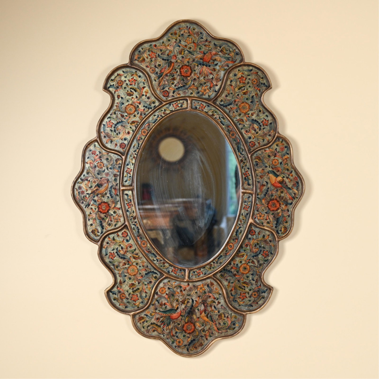 CONTEMPORARY EGLOMISE WALL MIRROR: Contemporary; apparently unmarked. Dimensions: H 40" x W 27.75" Condition: Intentionally antiqued finish; no issues to note.